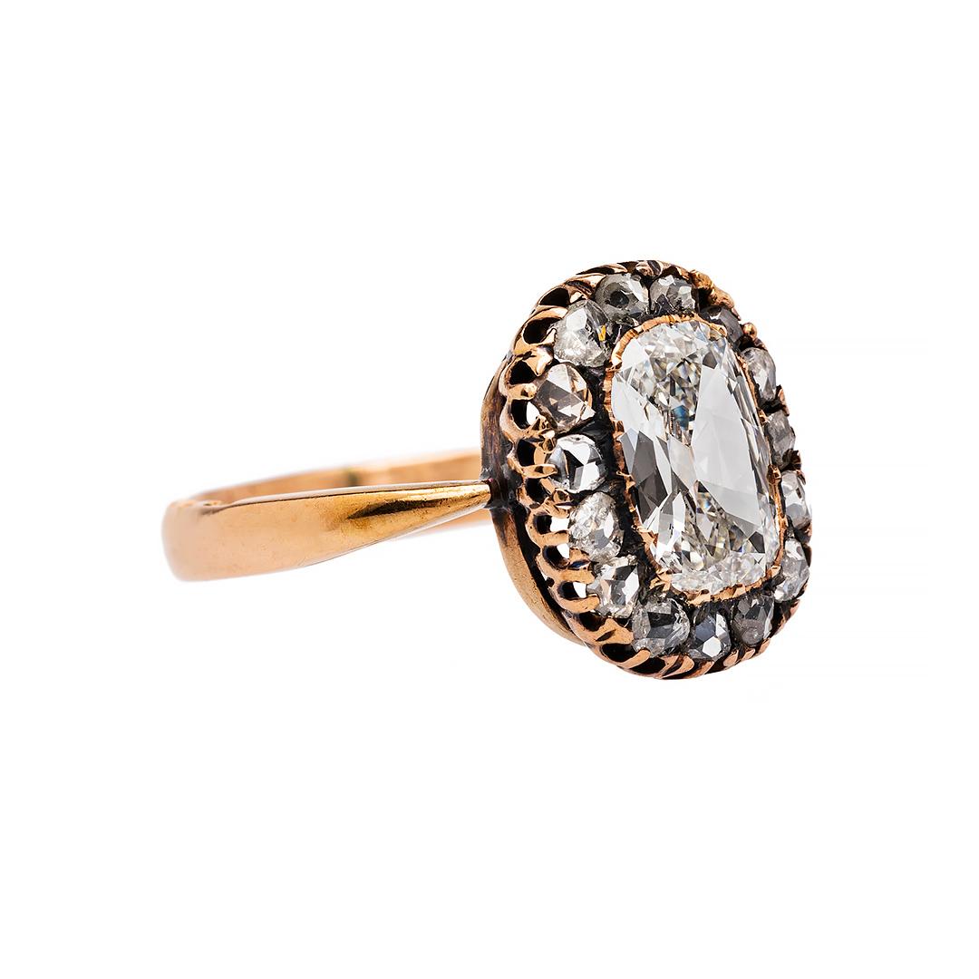 This is an extraordinary and authentic Early Victorian (circa 1845) 14k rose gold ring. This true antique ring has amazingly vivid Russian Hallmarks on the edge of the shank. Wrightwood centers a fifteen prong set diamond accompanied by EGL
