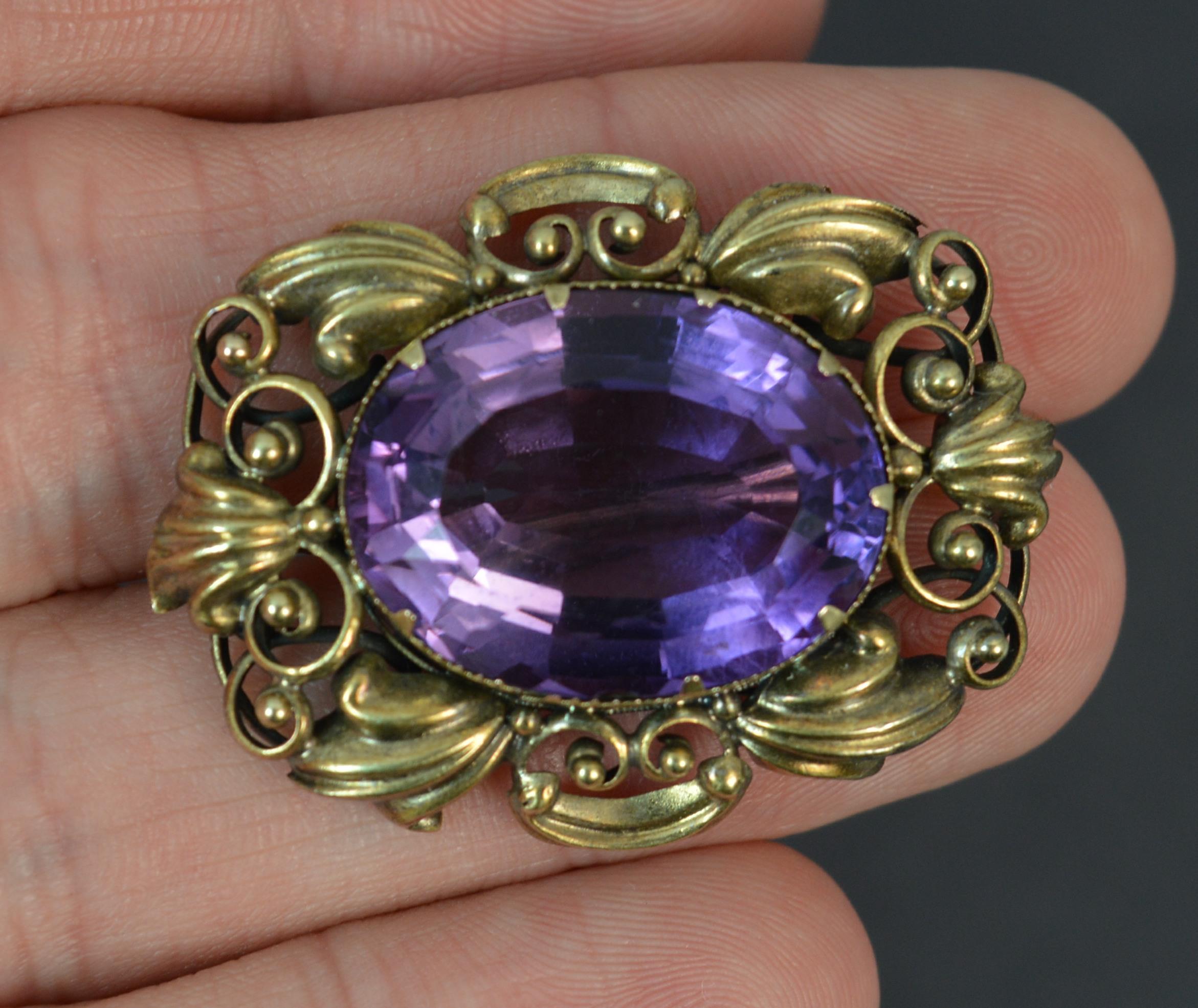 A stunning early Victorian period statement brooch.
Solid 15 carat yellow gold border.
Designed with an oval cut amethyst to the centre. Wonderful colour.

CONDITION ; Very good for age. Clean amethyst, issue free. Crisp gold design. Working pin.