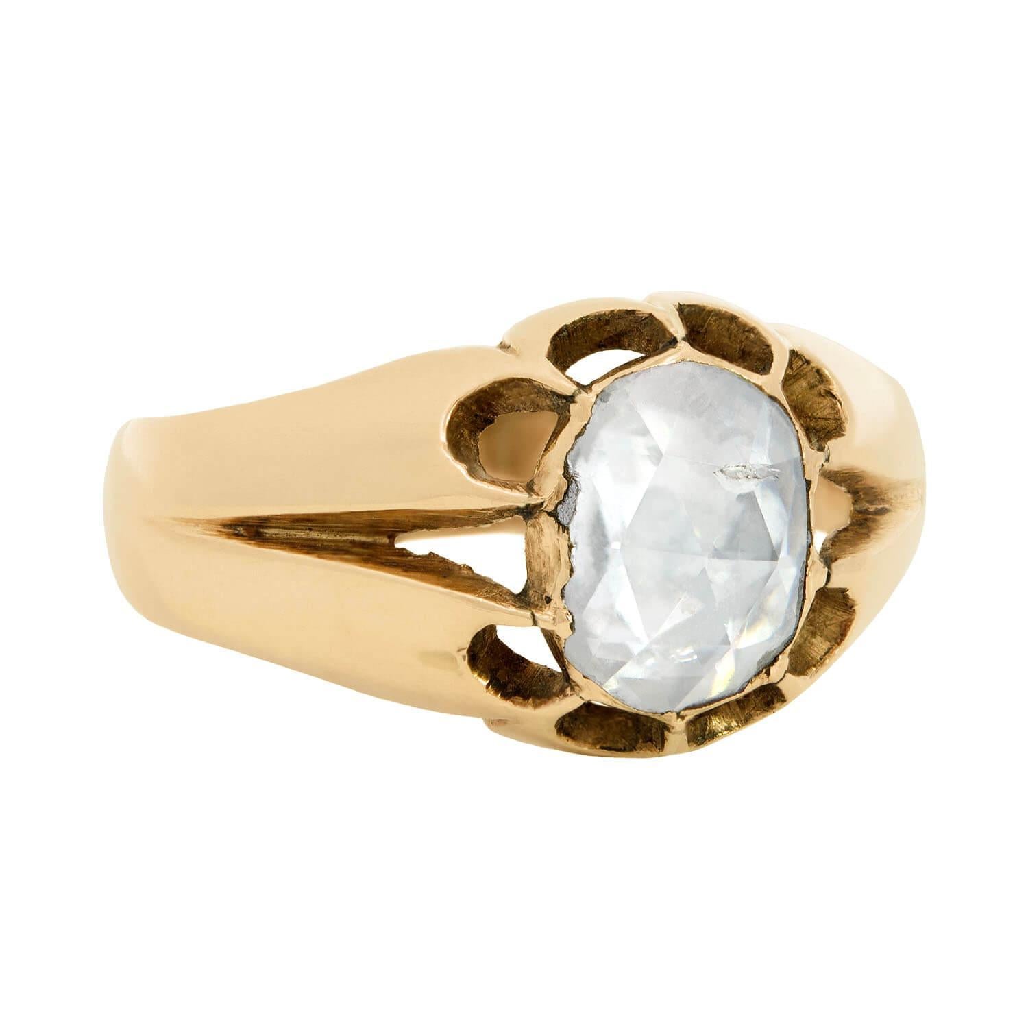 A beautiful diamond engagement ring from the Early Victorian (ca1850) era! Made of 15kt yellow gold, at the center of this gorgeous ring is a single sparkling rose cut diamond. The diamond has a total weight of approximately 0.85ct, and is suspended