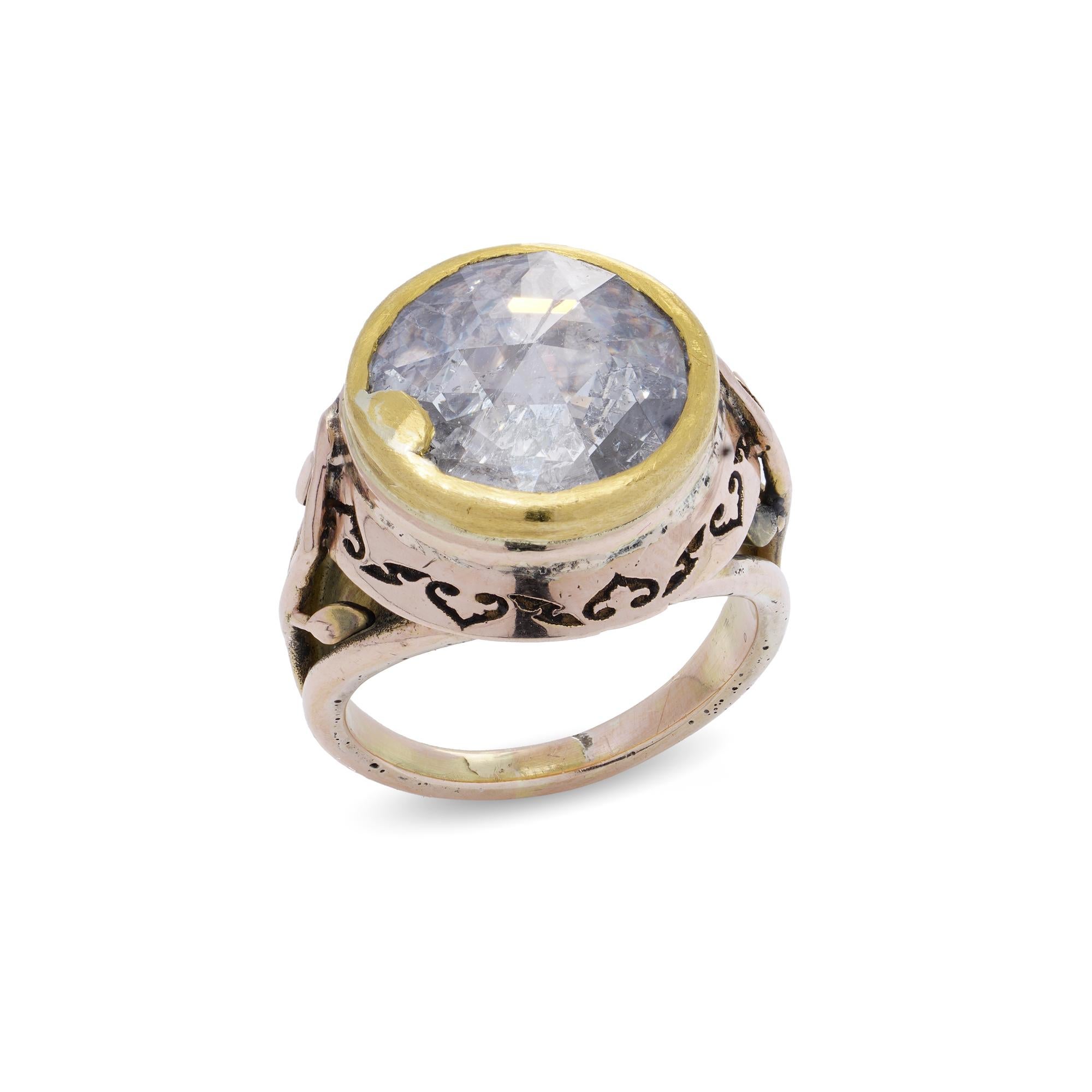 Early Victorian 15kt gold rose - cut diamond ring.

The ring feature a large rose-cut stone, which is an antique style of gemstone cutting dating back to the 16th century. This cut is known for its dome-like shape with a flat base, often giving it a