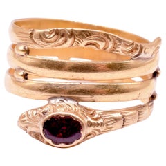 Early Victorian 18K Triple Layered Snake Ring with a Garnet Studded Head