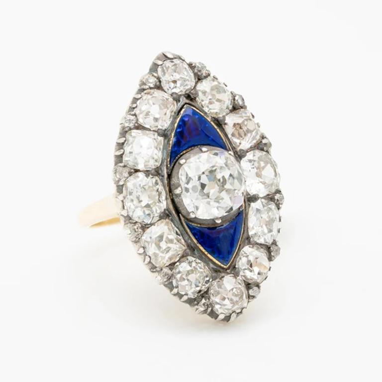 Early Victorian 18k Gold, Silver and 6.0cts. Old Mine Cut Diamonds and Blue Guilloché Enamel Ring 
c.1840s

Believed to be a descendant of the bagues au firmament (or, “rings of the heavens”) popularized by history’s most notorious figure of wealth,