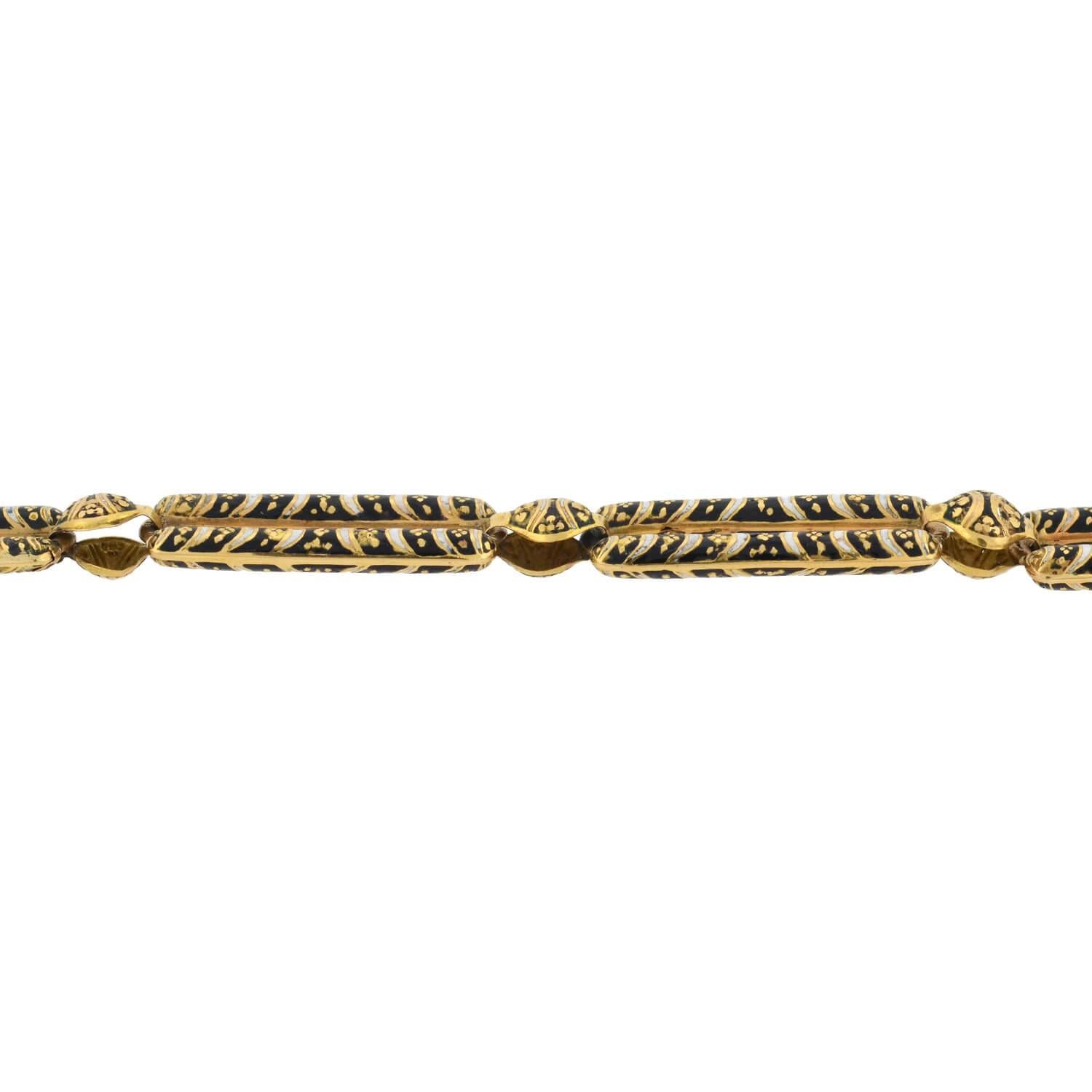 Although this necklace does not depict a traditional scenic Swiss image, it features the fine Swiss enamel craft, dating from the early Victorian (ca1850s) era! Crafted in vibrant 18kt yellow gold, the piece is comprised of elongated open bar links