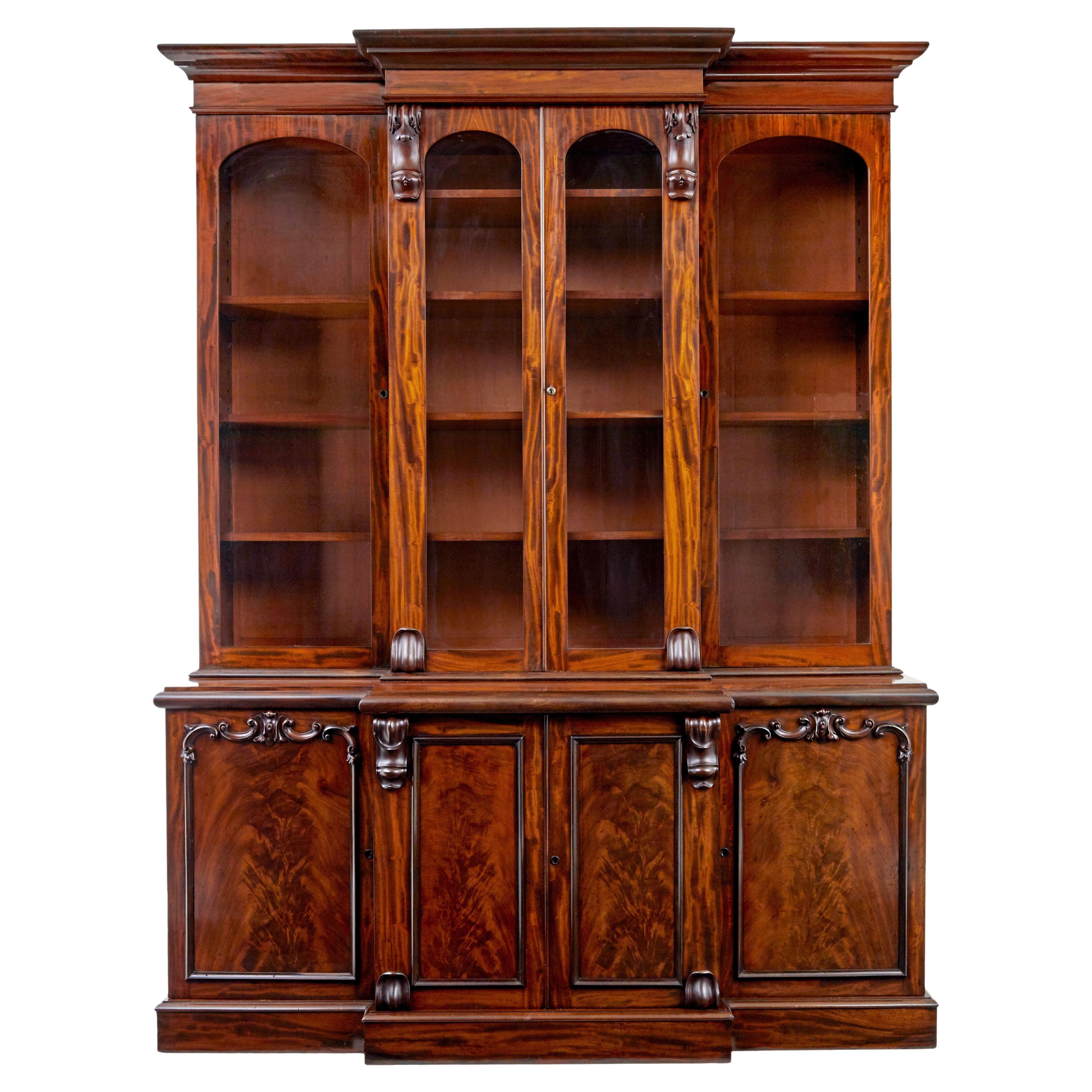 Early Victorian 19th century flame mahogany breakfront bookcase For Sale