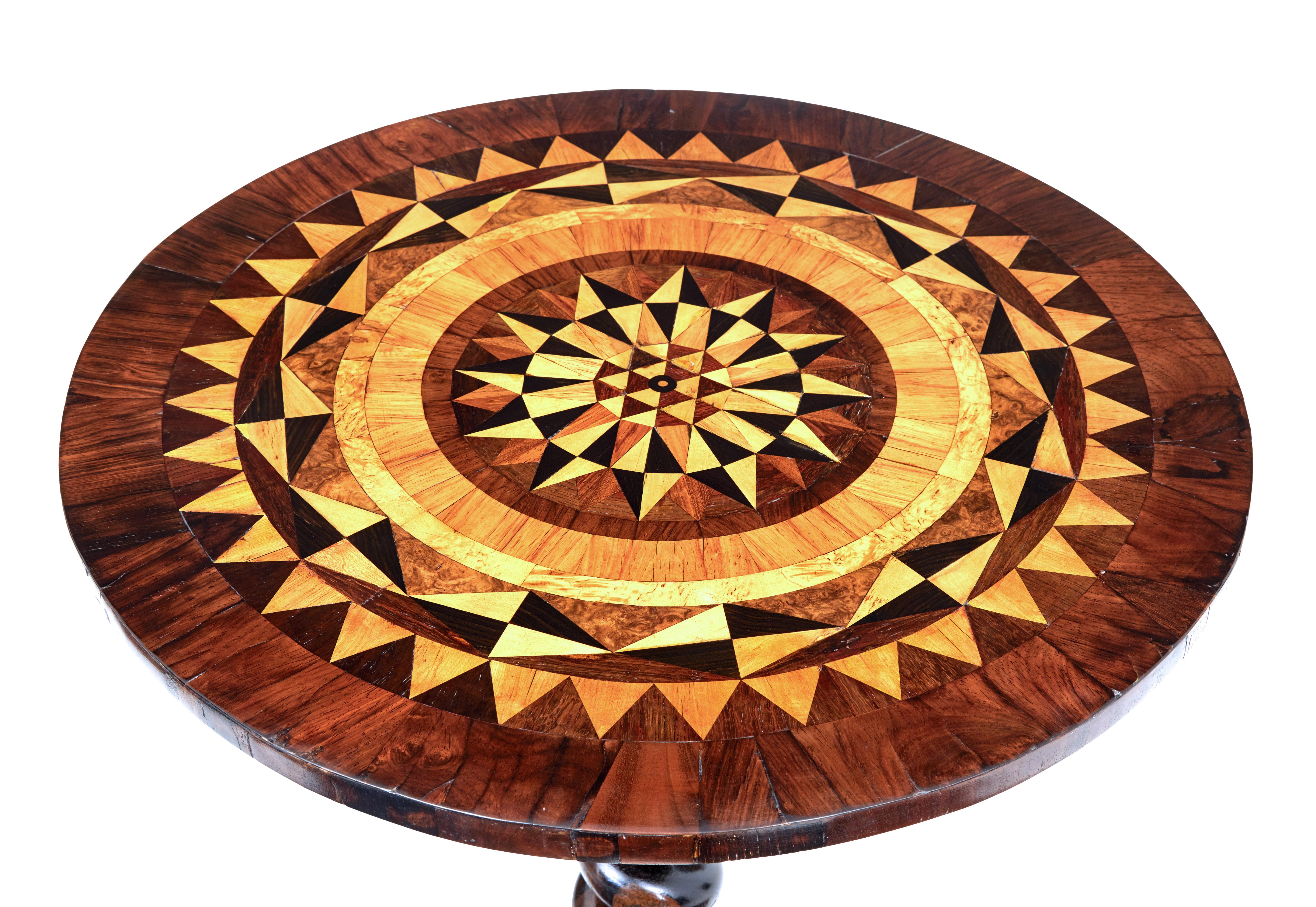 Good quality circular table with inlay, circa 1840.

Beautifully inlaid in a symmetrical pattern with walnut, birch, coromandel and various burrs, with outer walnut edge.

Standing on a barley twisted stem and carved solid legs with scrolled