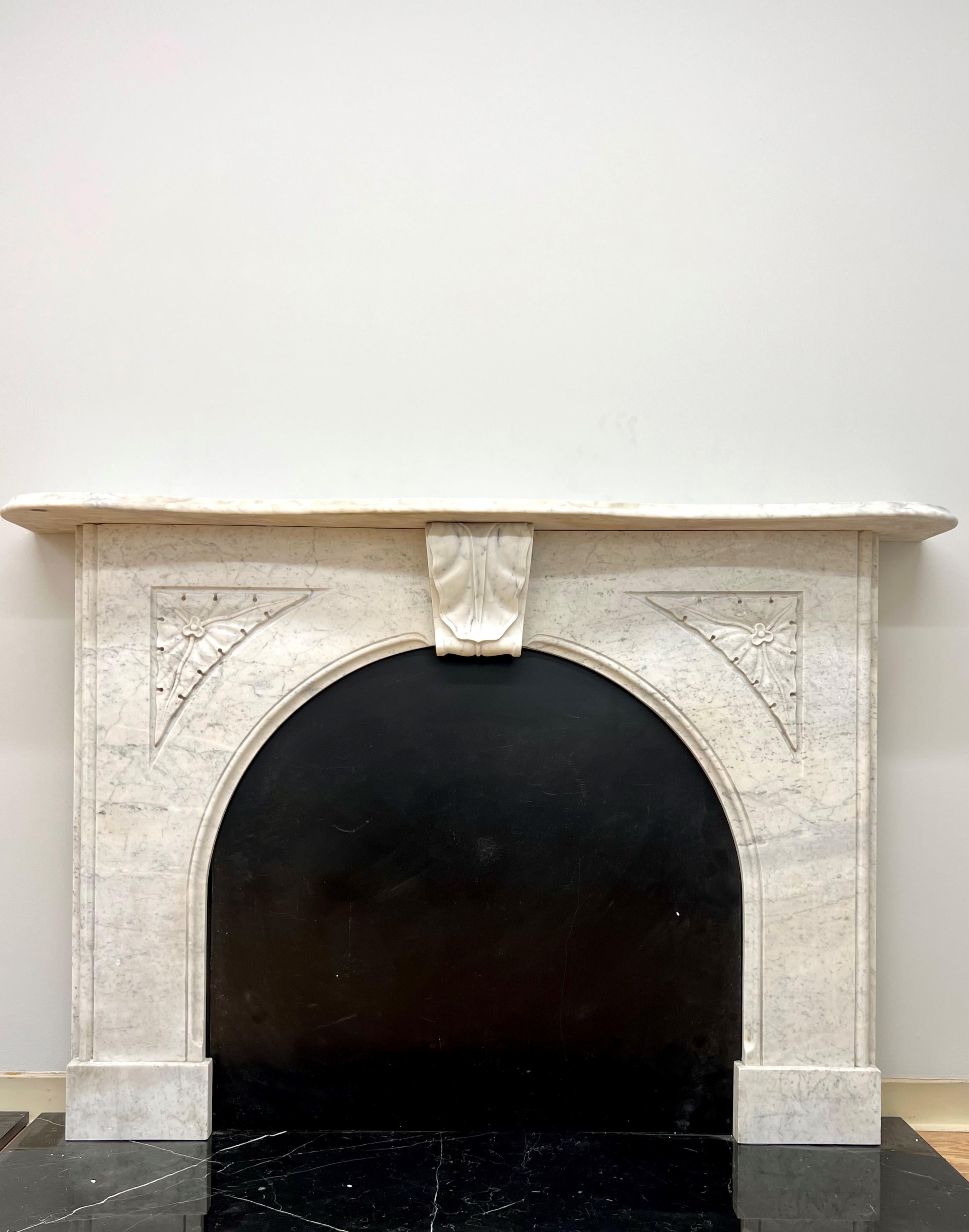 Early Victorian arched mantelpiece hand carved in Carrara marble.

Overall: 59