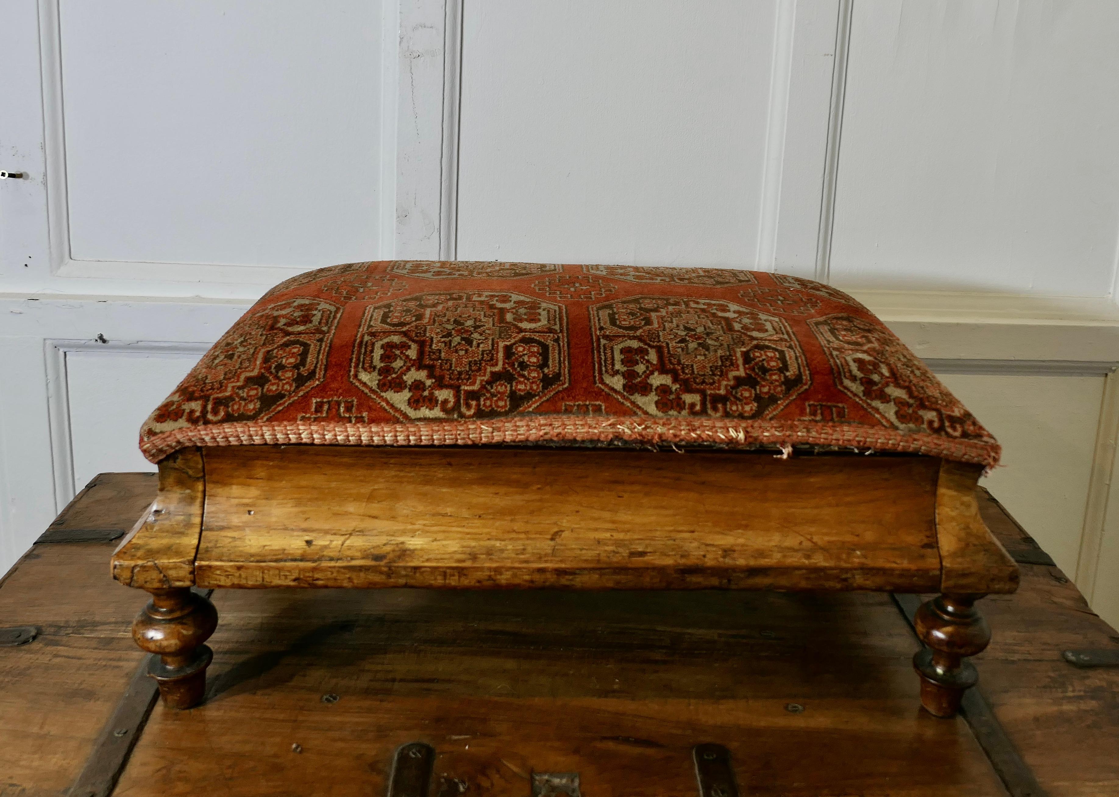 Early Victorian Bed Step, Foot stool

This is a Victorian piece, it is made in light walnut and is covered in its original silk carpet material, originally this piece would have been used as a step to climb in to a high bed, however now it is known