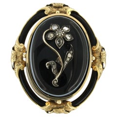 Early Victorian brooch with onyx and rose cut diamonds 14k gold and silver