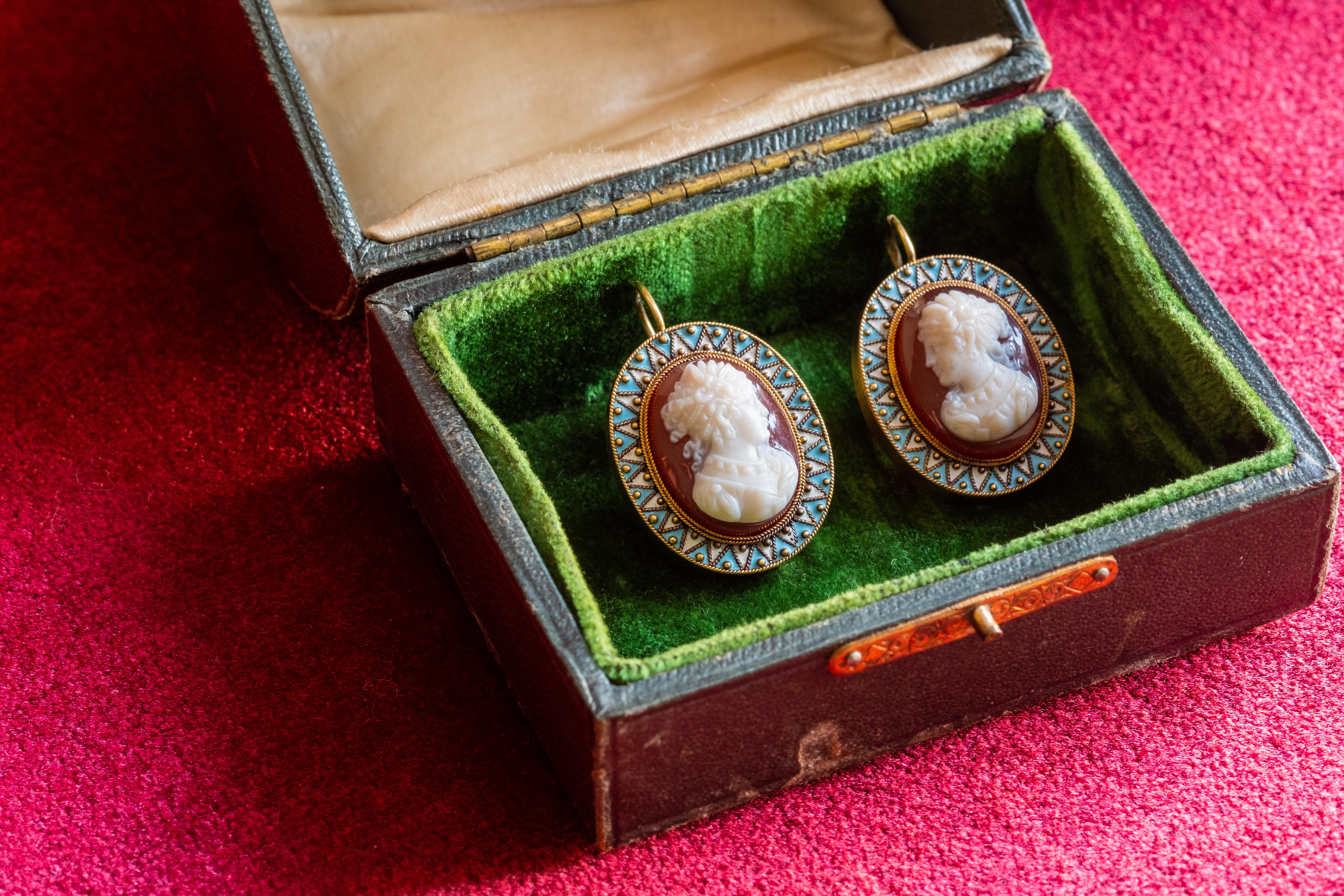 Exquisite mid Victorian cameo and enamel earrings, circa 1850s. 
Beautifully designed and incredible hand-carved individual cameos of two goddesses are set with a wonderfully high relief. Set in 9ct gold, and enamelled in blue and white interwoven