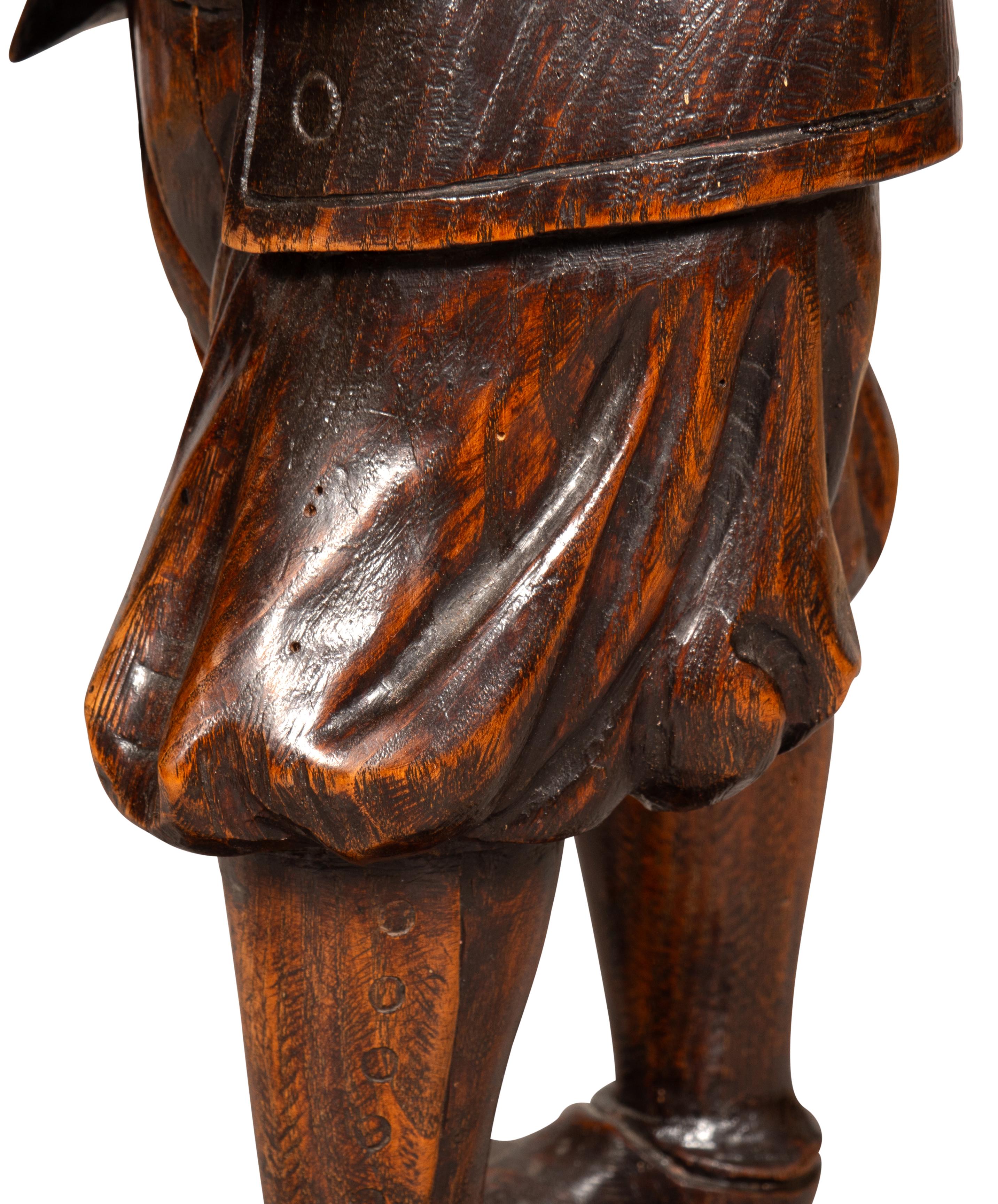Early Victorian Carving Of A Bagpiper For Sale 5