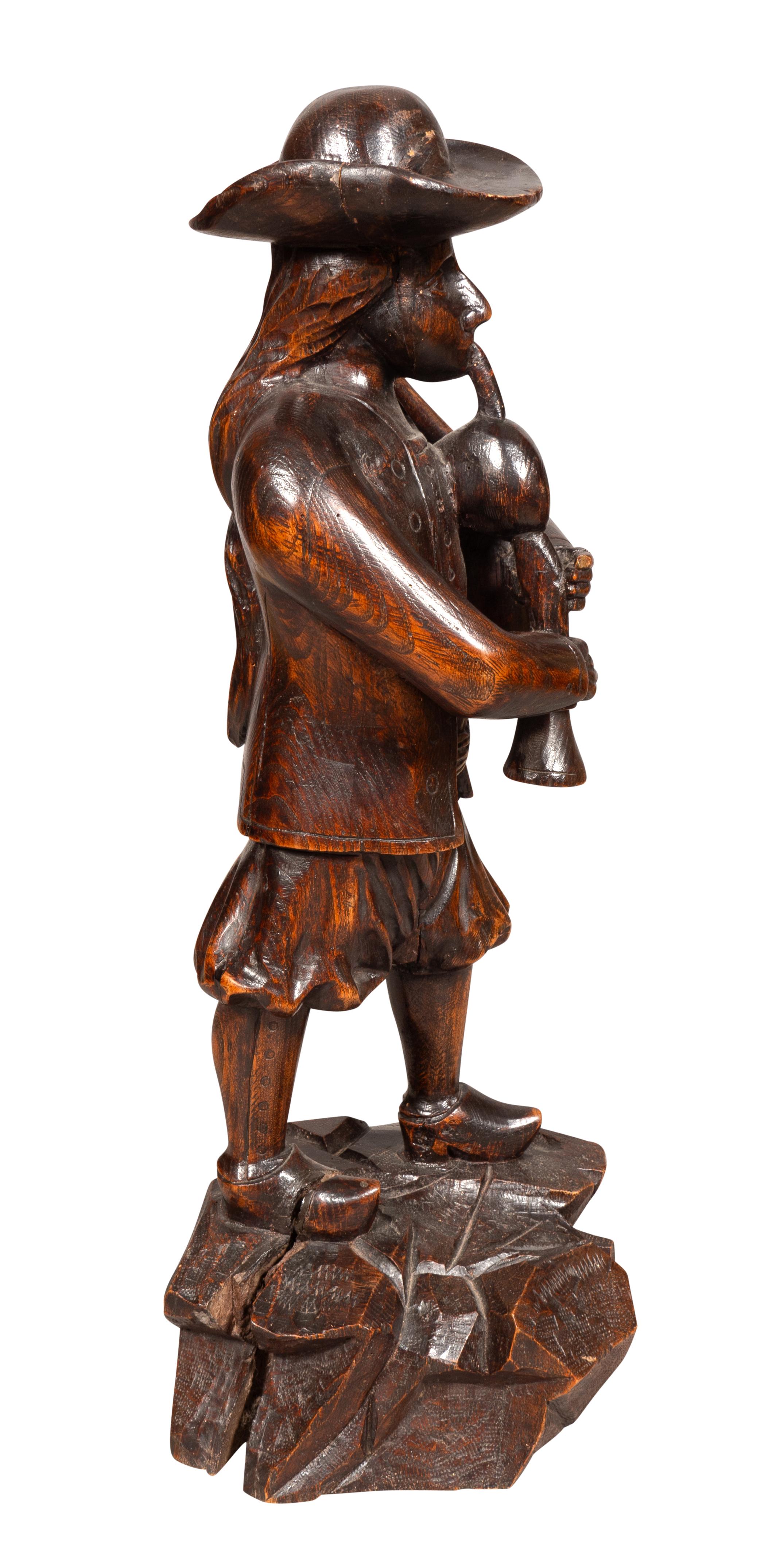 English Early Victorian Carving Of A Bagpiper For Sale