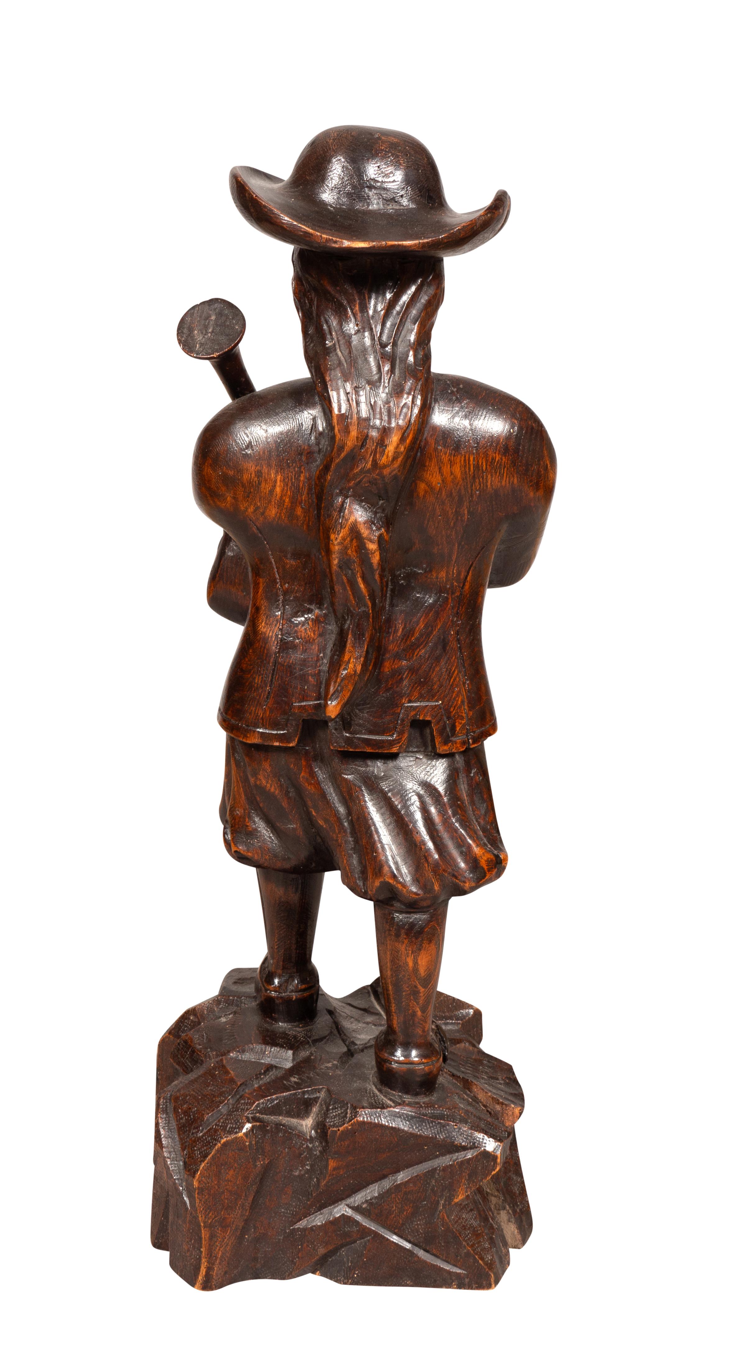 Mid-19th Century Early Victorian Carving Of A Bagpiper For Sale