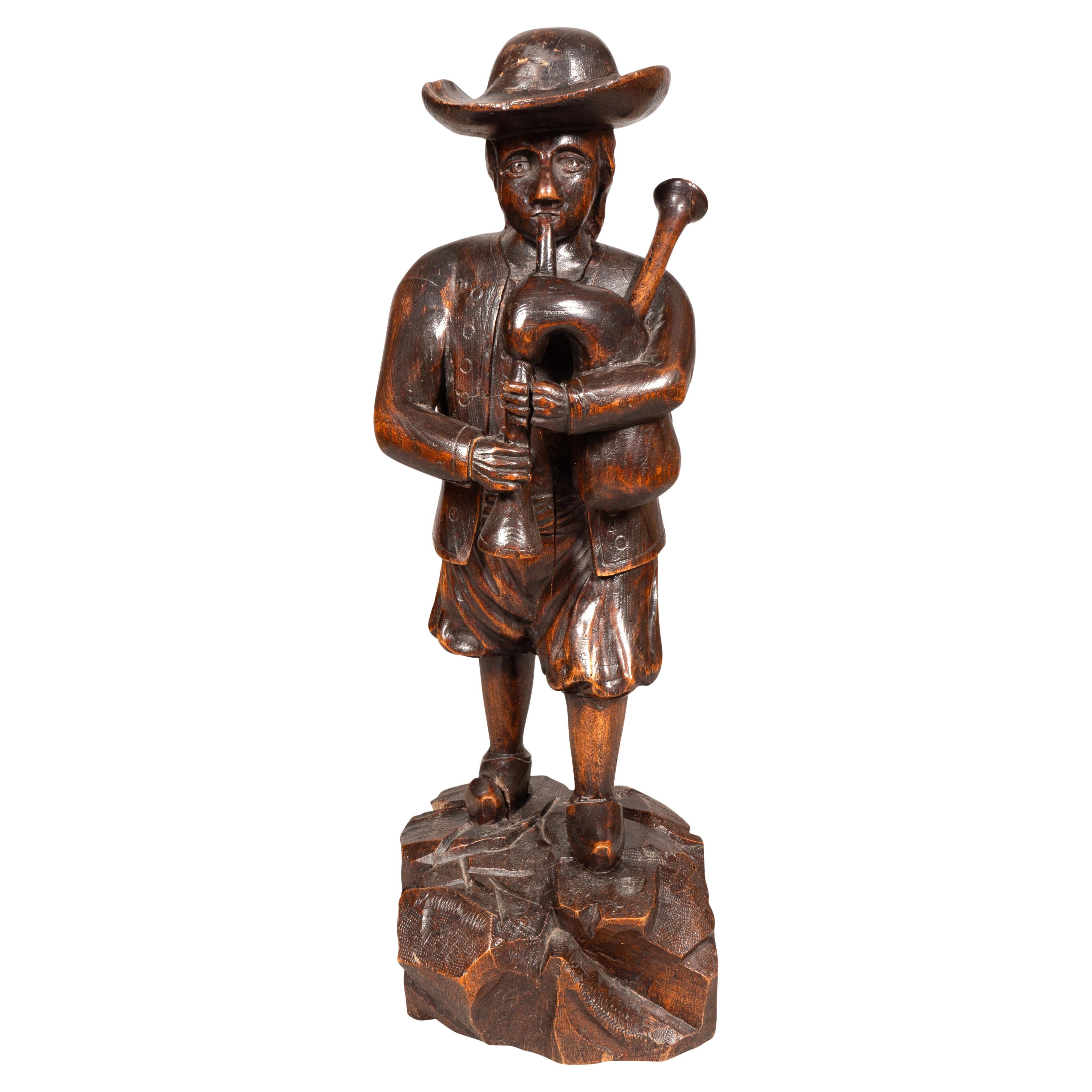 Early Victorian Carving Of A Bagpiper For Sale