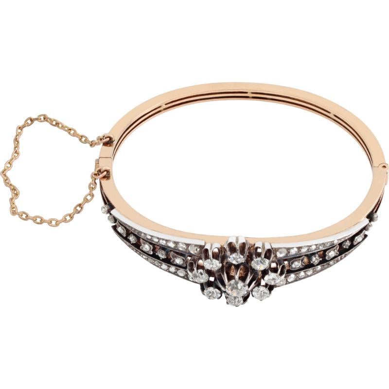 Early Victorian diamond bangle in 14k yellow gold and silver. Old mine cut and rose cut diamonds total approx. weight: 2.50 carats, Comes with security chain. Fits 6-7.5 inches wrist.