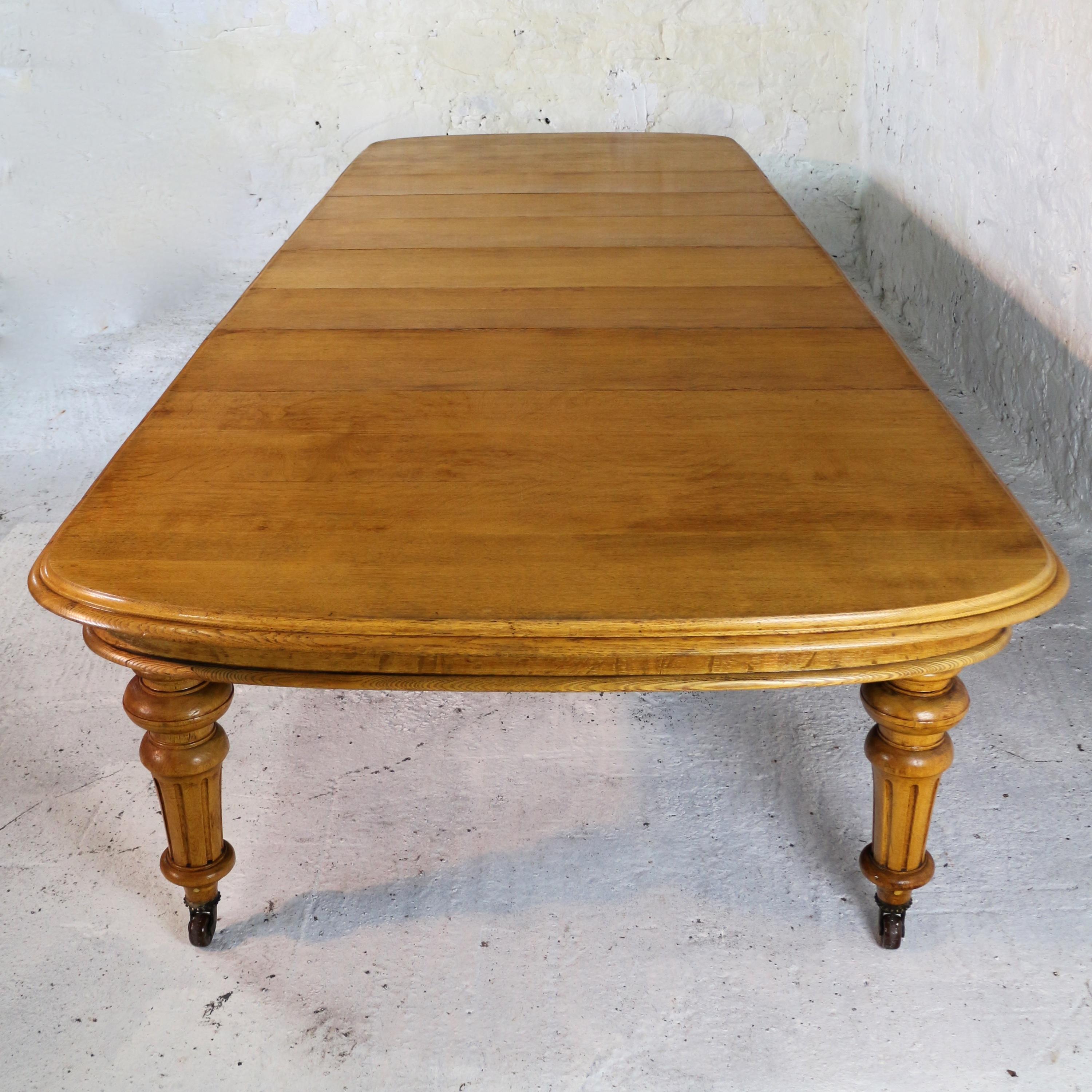 Brass Early Victorian Extra Wide Oak Dining Table and Six Leaves, Seats 18 For Sale