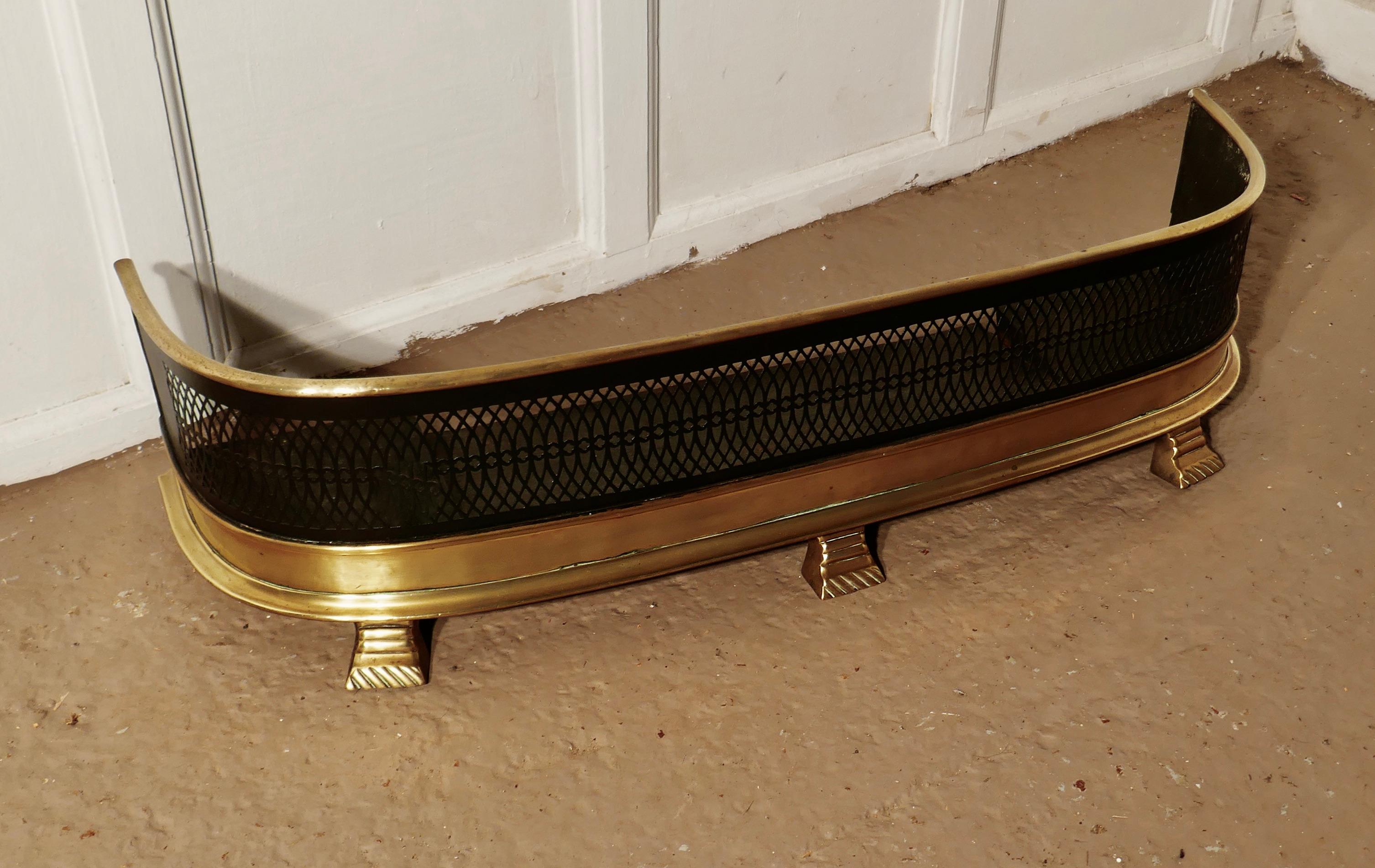 Early Victorian fireside Fender

A Victorian antique Fender often known as a nursery guard as it completely surrounds the fire 
The fender has a slightly curved brass top rail, steel metal mesh and a deep brass base with decorative broad