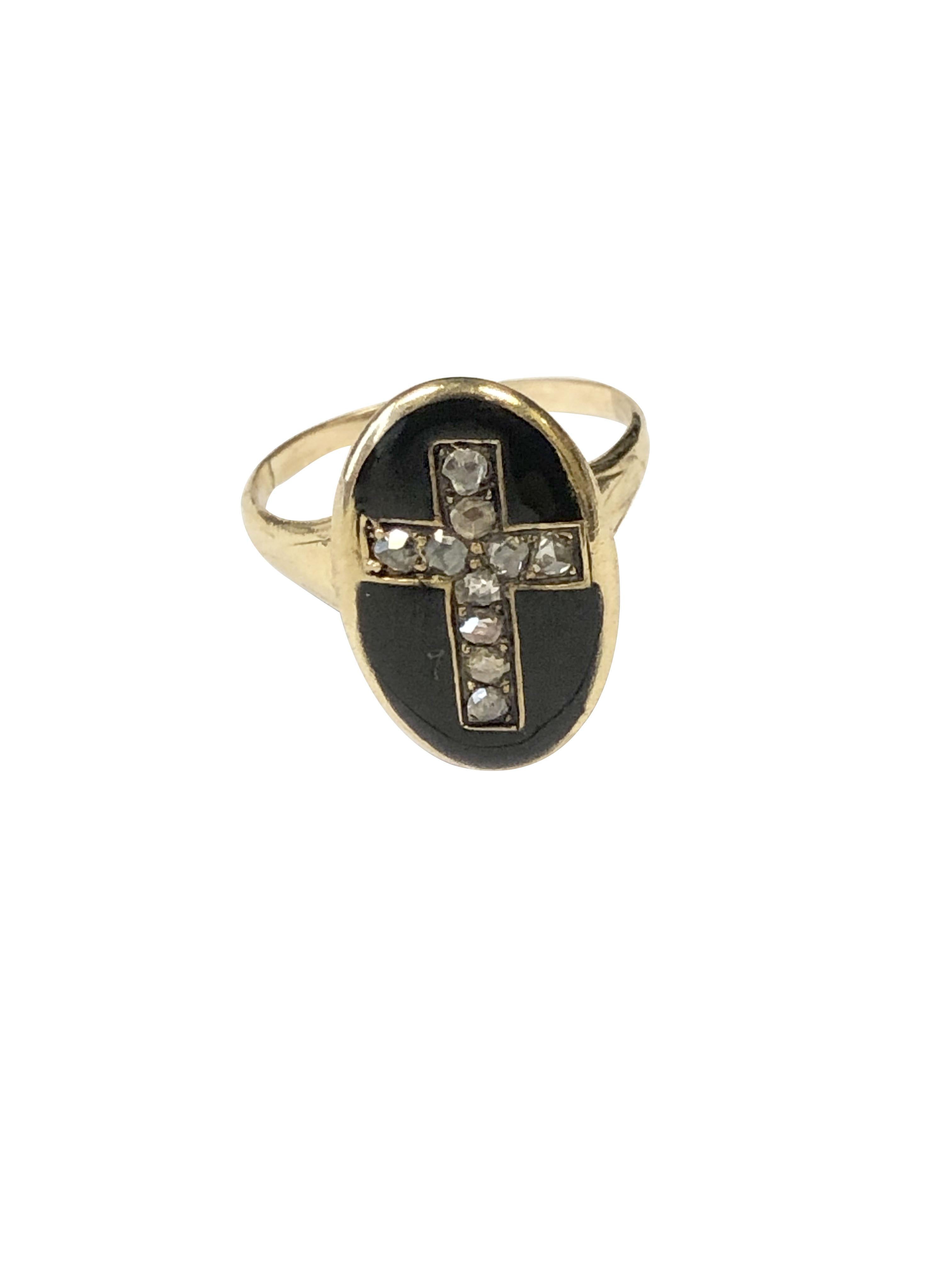 Circa 1850s Yellow Gold Mourning Ring, the top of the ring measures 5/8 X 7/16 inch and is finished in Black Enamel with an inset Cross of Rose Cut Diamonds. Finger size 5 3/4. 