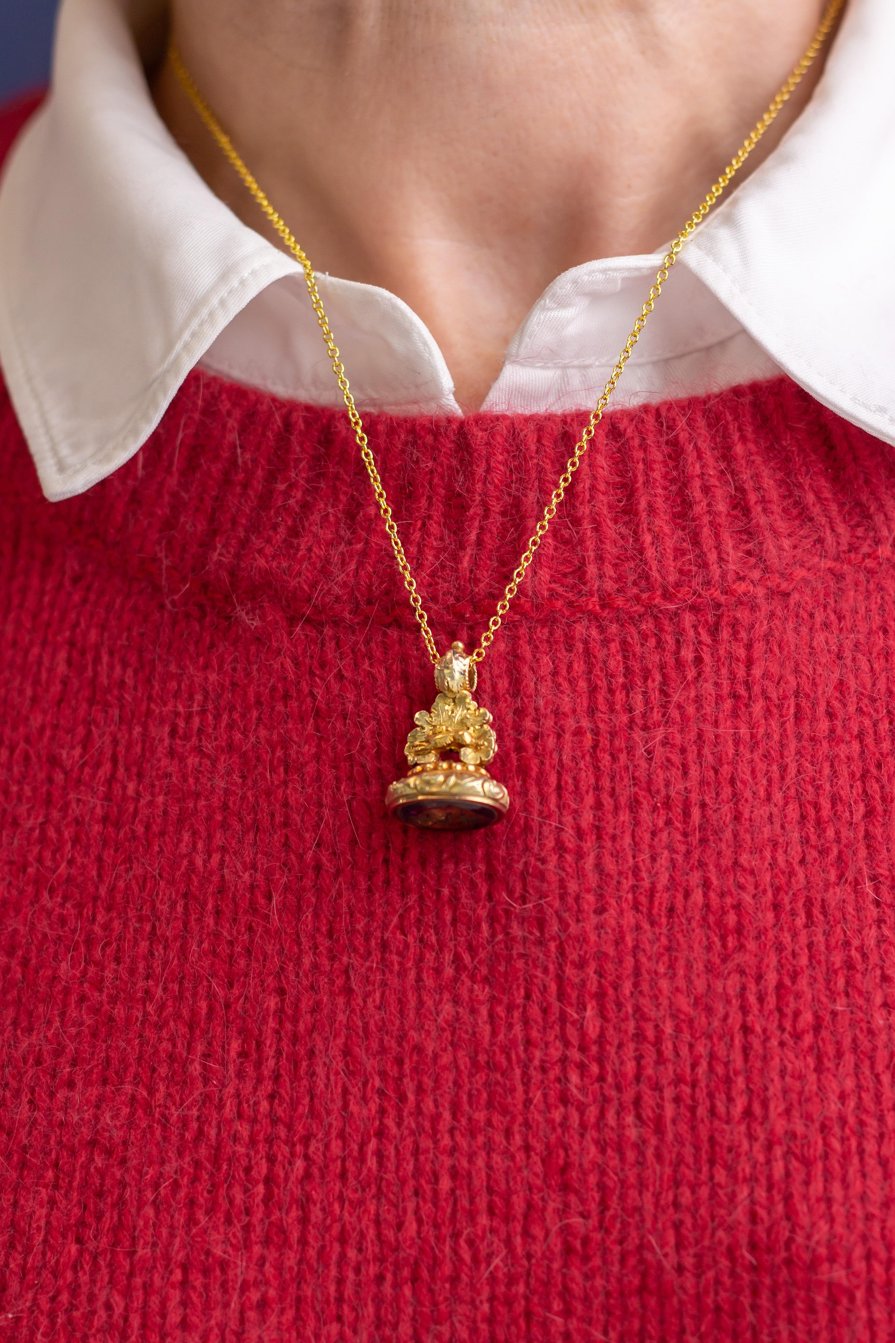 This beautiful 19th Century fob features an oval amethyst intaglio seal with initials inscribed into it. The piece dates to circa 1840, is gold filled, and depicts a small hare or rabbit jumping across the top of the piece near the bale. The