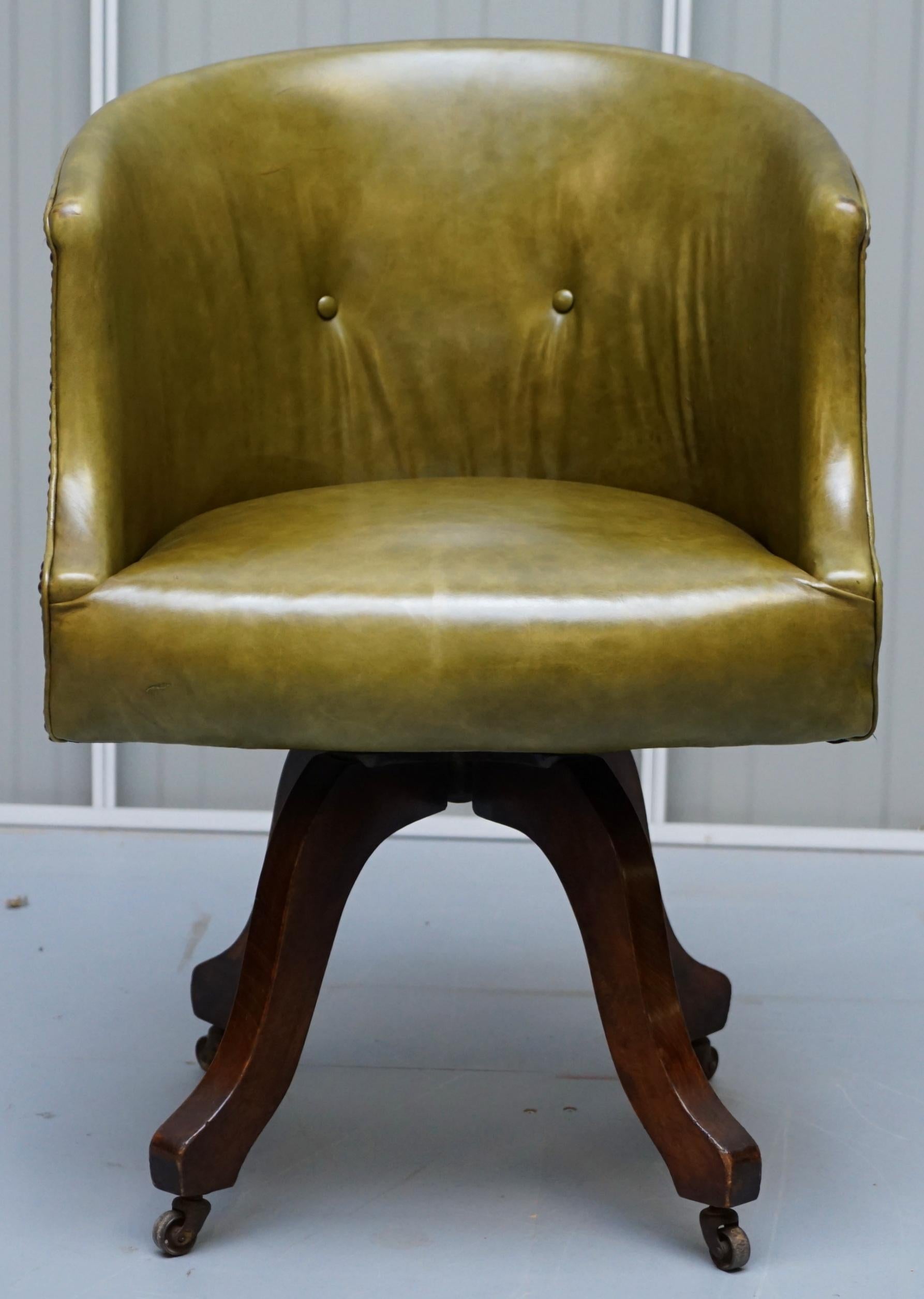 We are delighted to offer for sale this lovely early Victorian green leather barrel back captains chair with oak swivel base

A very good looking well made original chair. The base and frame is all solid English oak, its circa 1860, a very nice
