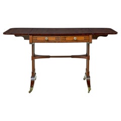 Early Victorian inlaid mahogany sofa table