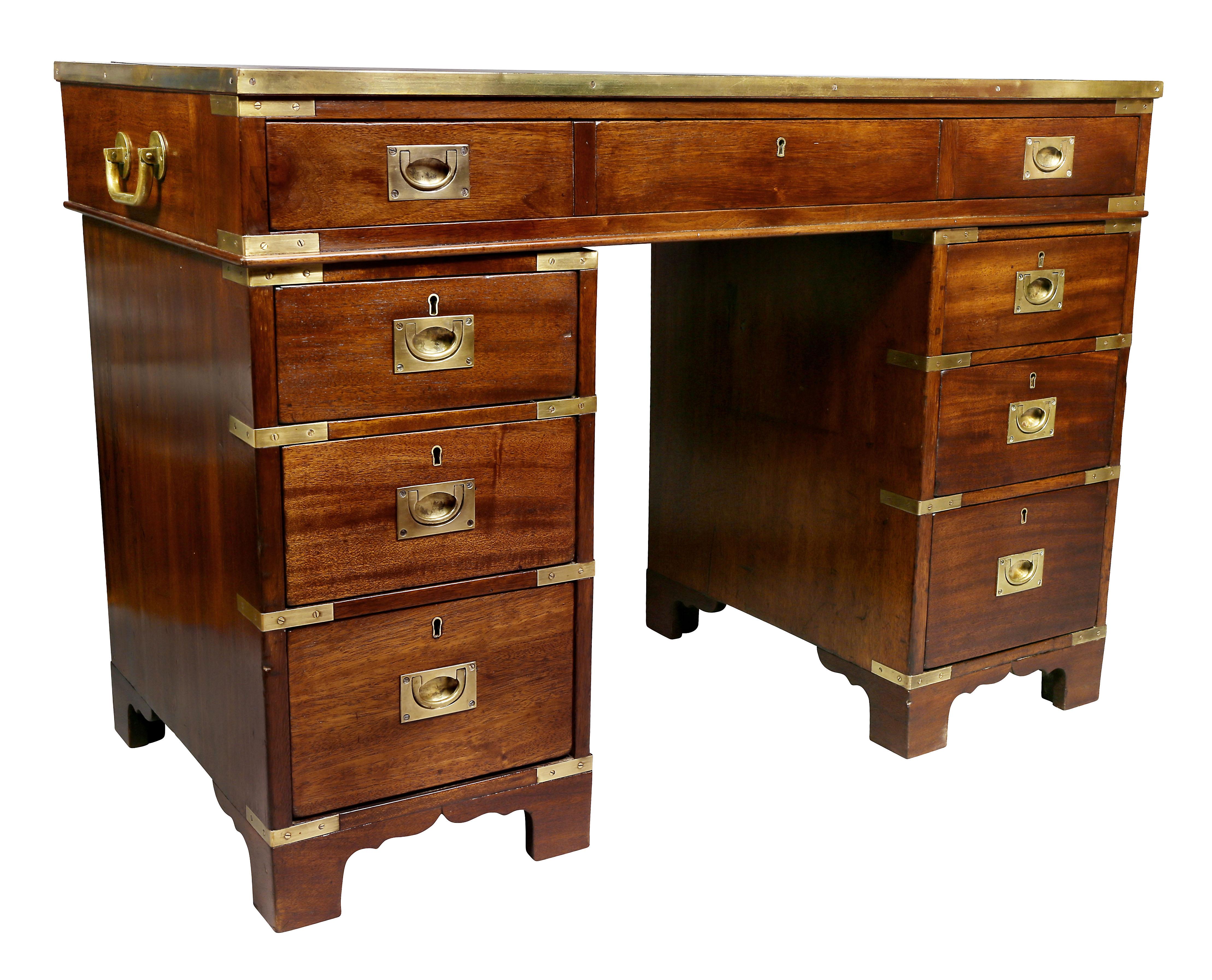 With a new inset tooled black leather top with wood and brass edge over a long drawer over two banks of three drawers, in three parts, side handles for top. Back finished.