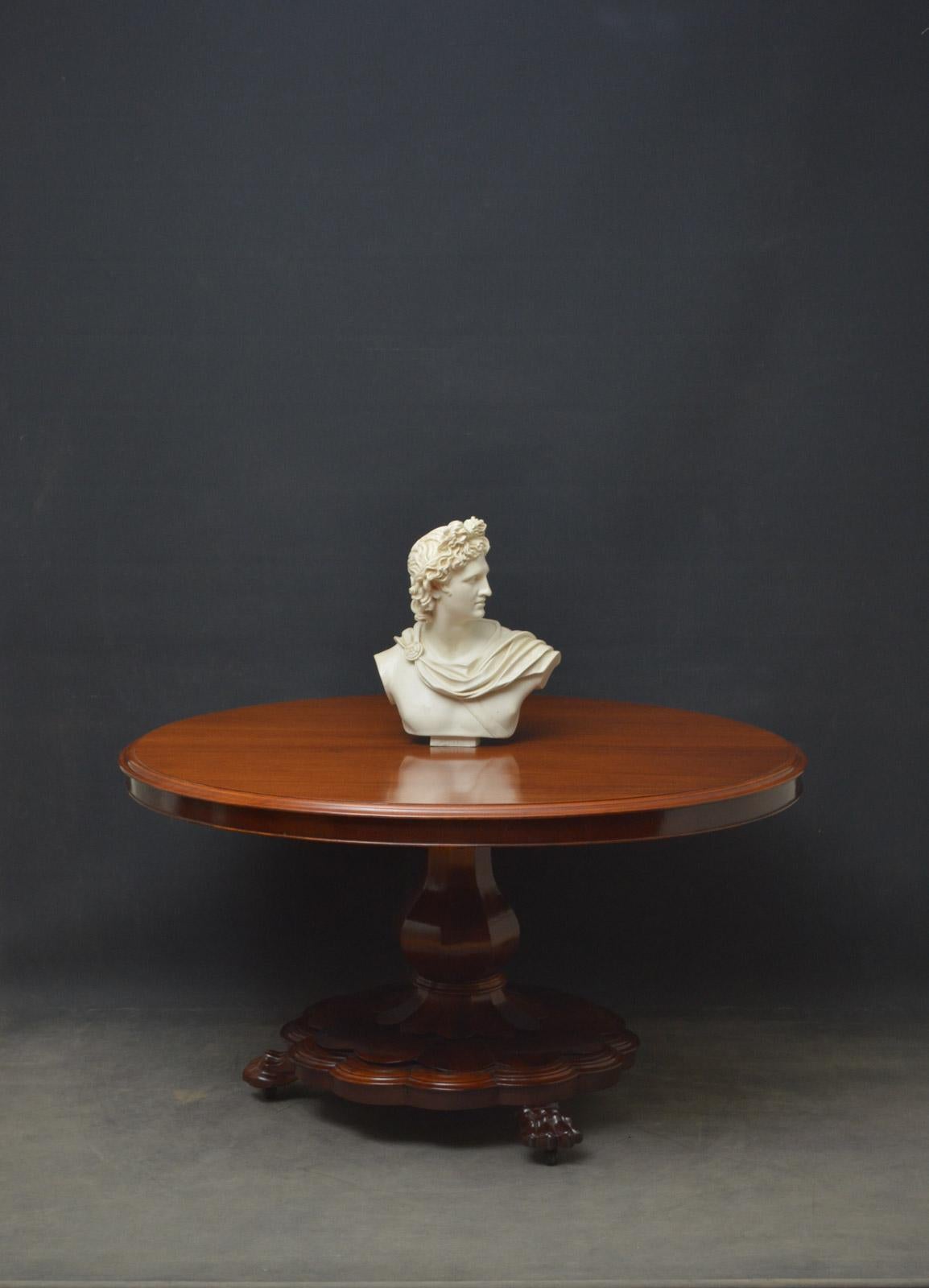 Sn4604 an elegant early Victorian mahogany centre or dining table, having figured mahogany top with moulded edge, raised on vase shaped faceted column terminating in petal shaped vase in 3 paw feet. This antique table has been sympathetically