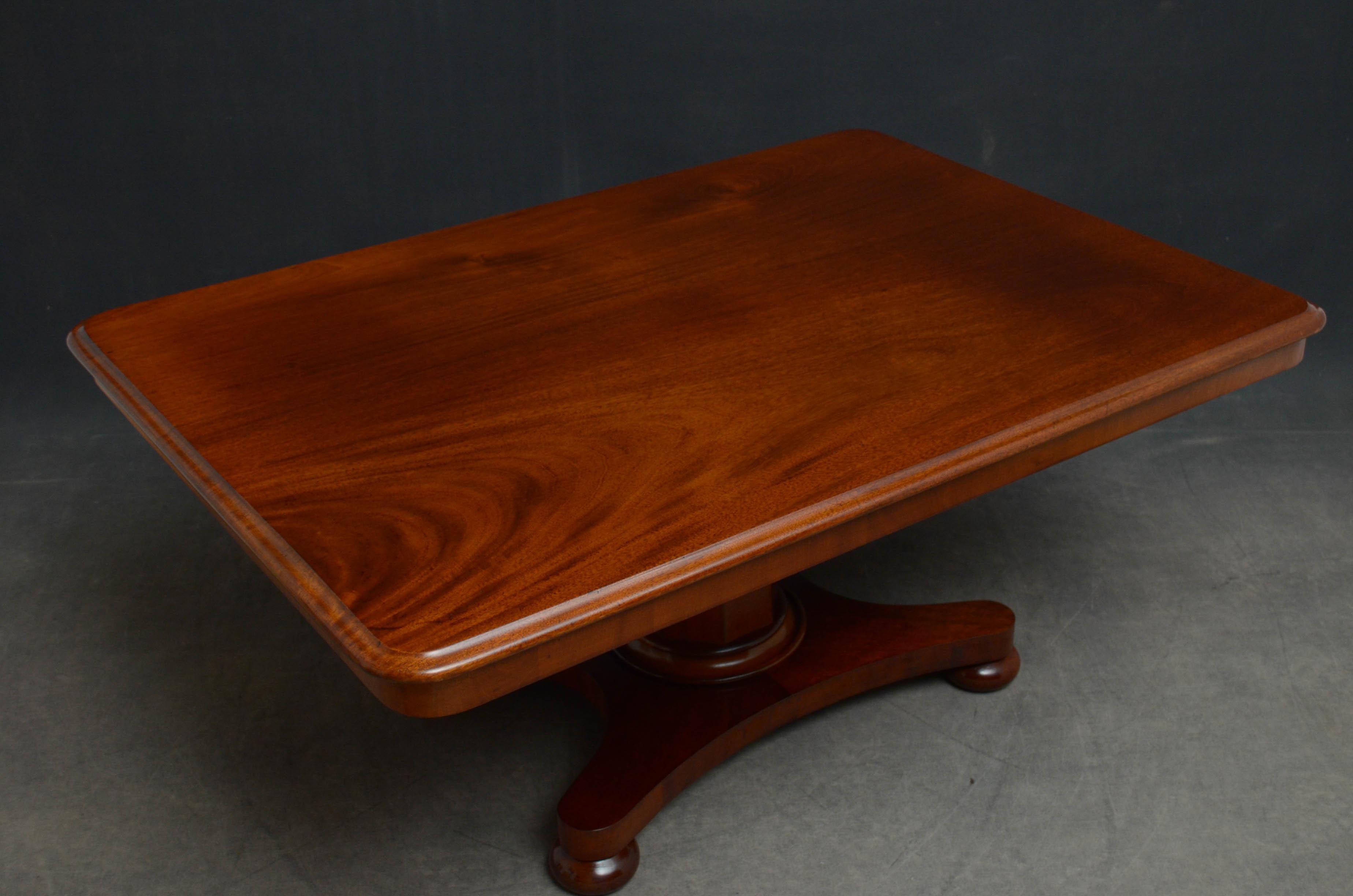 Sn4857 simple and elegant early Victorian mahogany coffee table, having figured mahogany top with moulded edge above flat faceted column terminating in shaped base and original bun feet. This antique table has been reduced to coffee table size, it