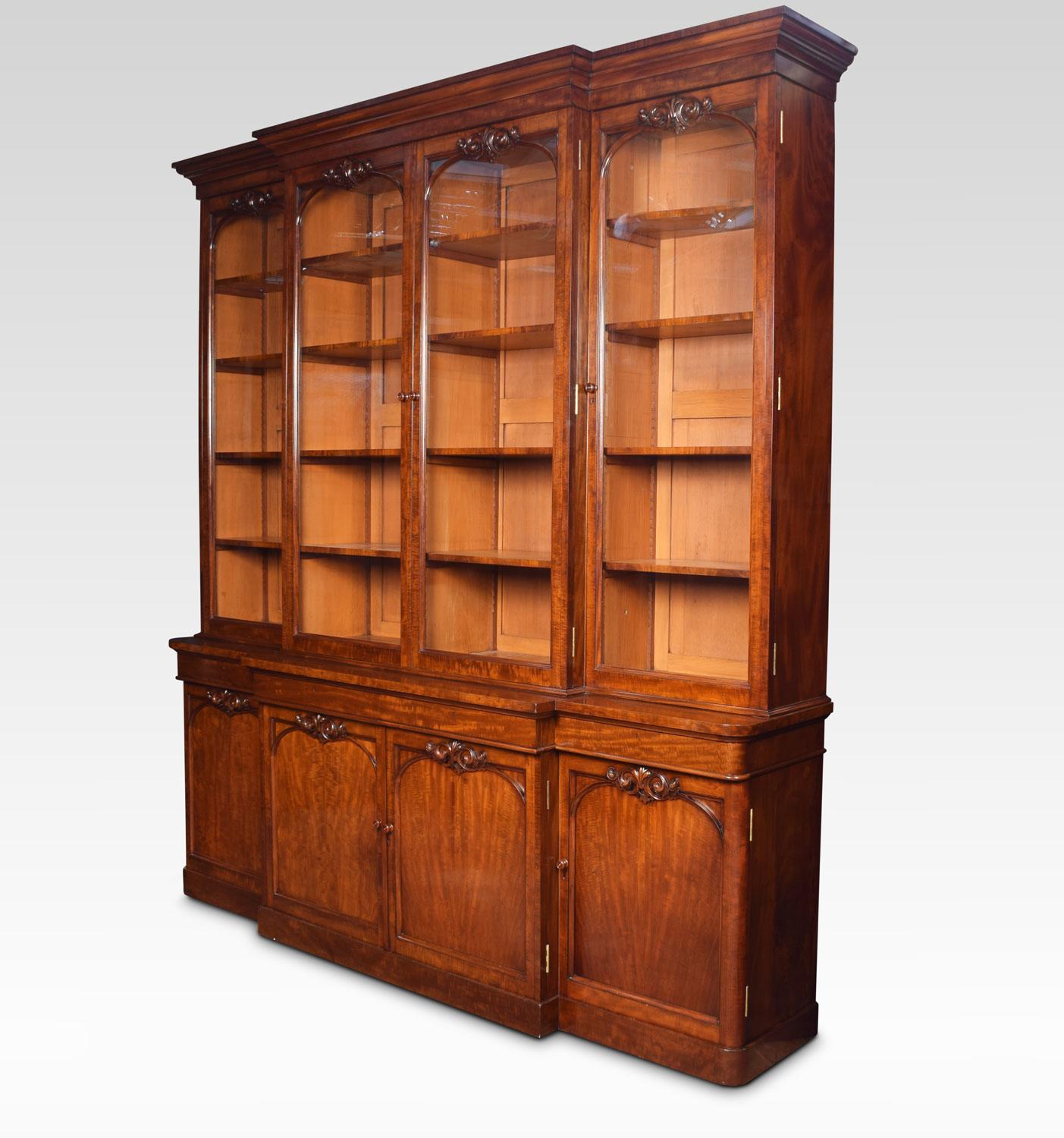 Early Victorian mahogany library breakfront secretaire bookcase, the stepped and molded cornice above the four upper glazed doors, opening to reveal adjustable shelves. The base with two central draws one fitted with secretere with original tooled
