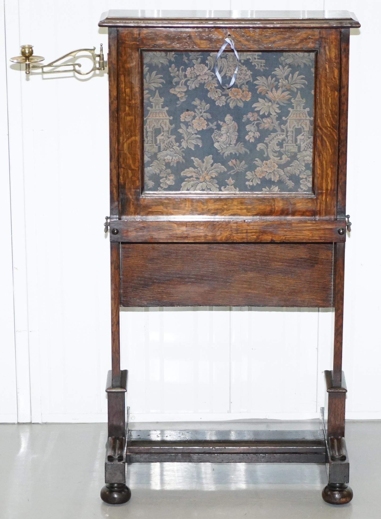 We are delighted to this very rare Victorian oak Escritoire drop front desk with Oriental tapestry and campaign handles

A very good looking early Victorian piece, this is fundamentally a drop front desk that has been made in a very compact and