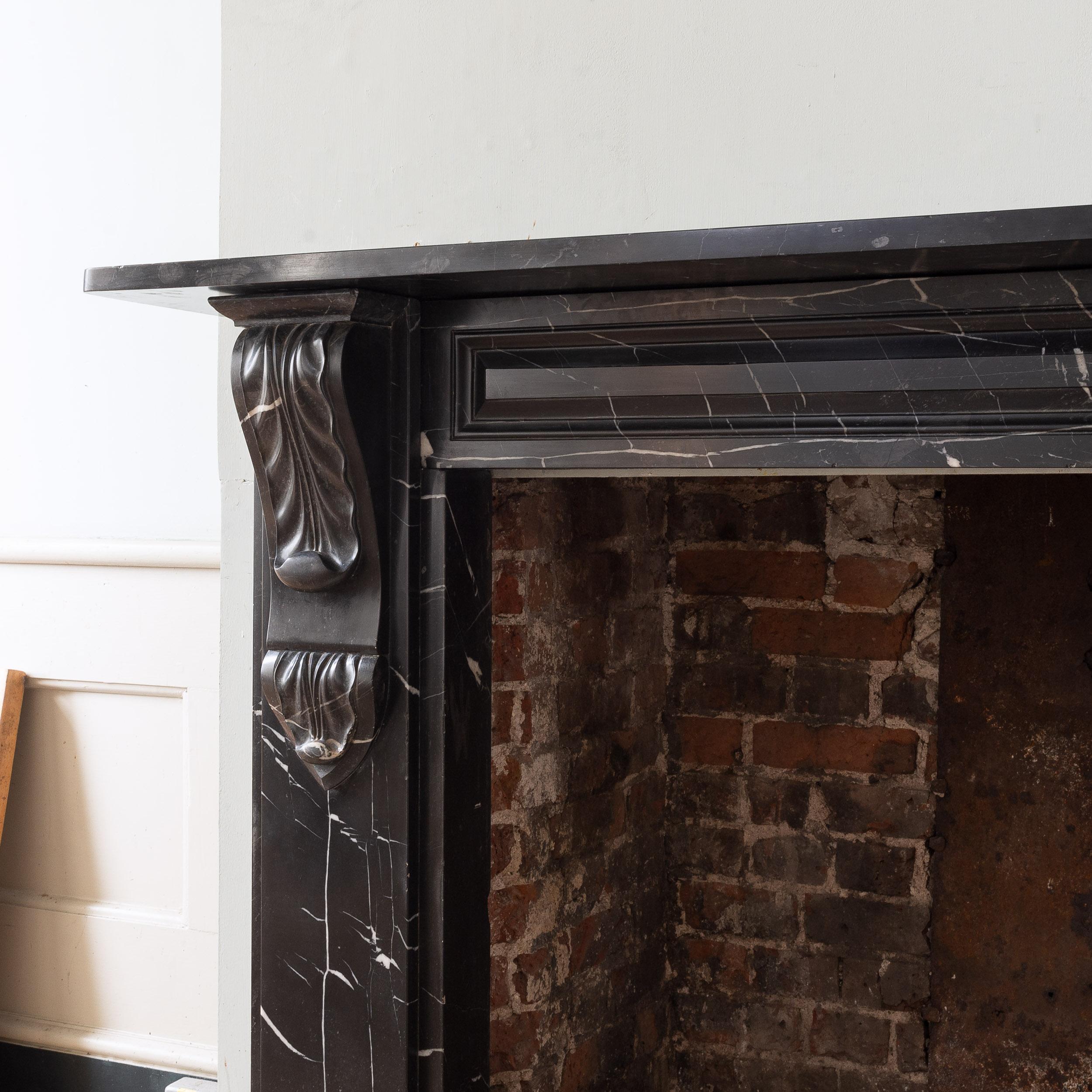 Limestone Early Victorian Radford Black Fireplace  For Sale