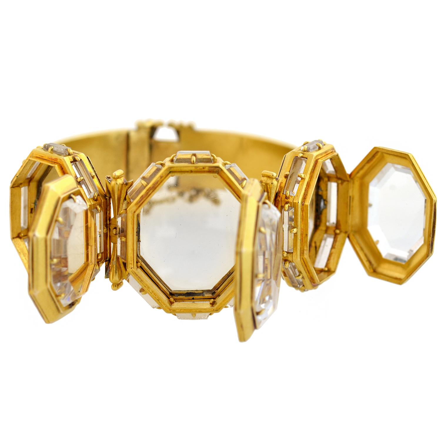 This outstanding locket bracelet from the Early Victorian era (ca1850) is an incredibly rare and unusual find! Crafted in vibrant 15kt gold, it has a trio of lockets that line the front, each boasting an attractive geometric shape. The face and back
