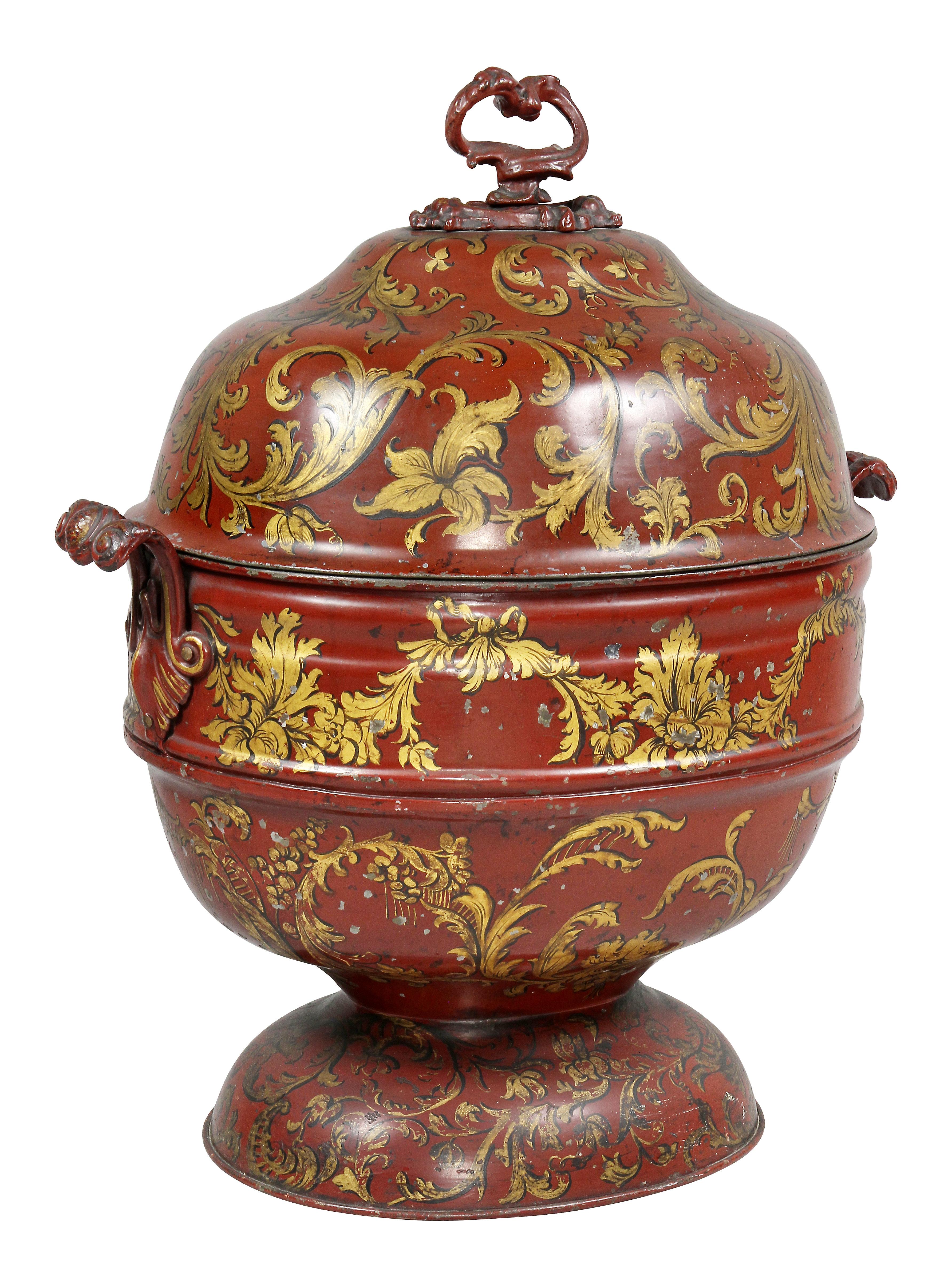 With oval domed cover and handle and conforming bowl section, oval footed base, scroll handles, gilt leaf decoration overall.