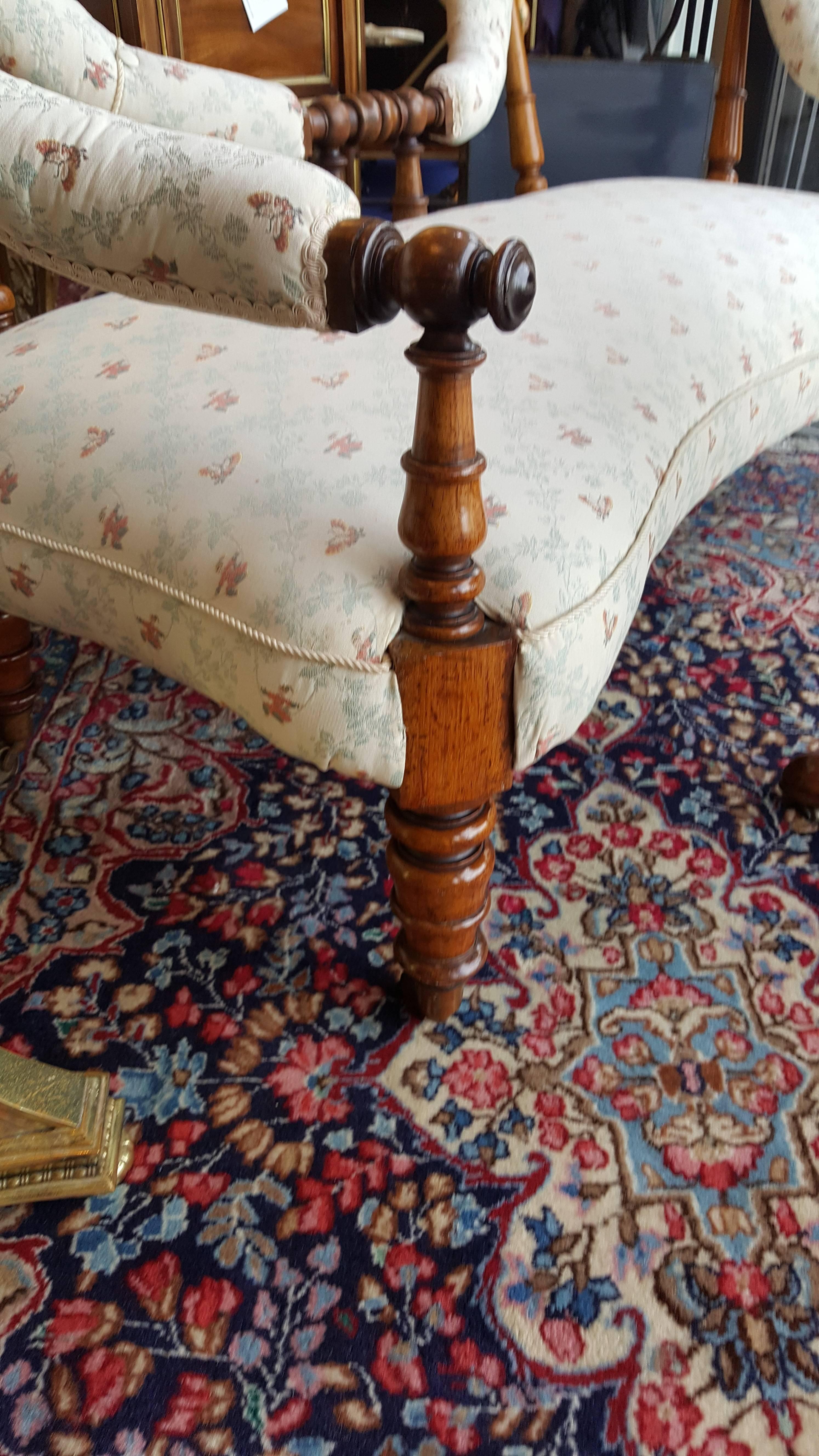 Early Victorian rosewood two-seat settee of serpentine shape. Measures: 63