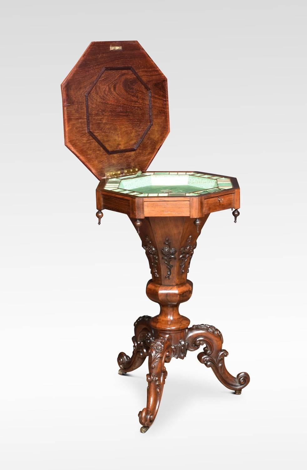 Early Victorian rosewood sewing table, of trumpet form, the octagonal lift up lid opening to reveal fully fitted interior. The base with blind fretwork and turned finials. All raised up on tripod base terminating in scrolled feet and