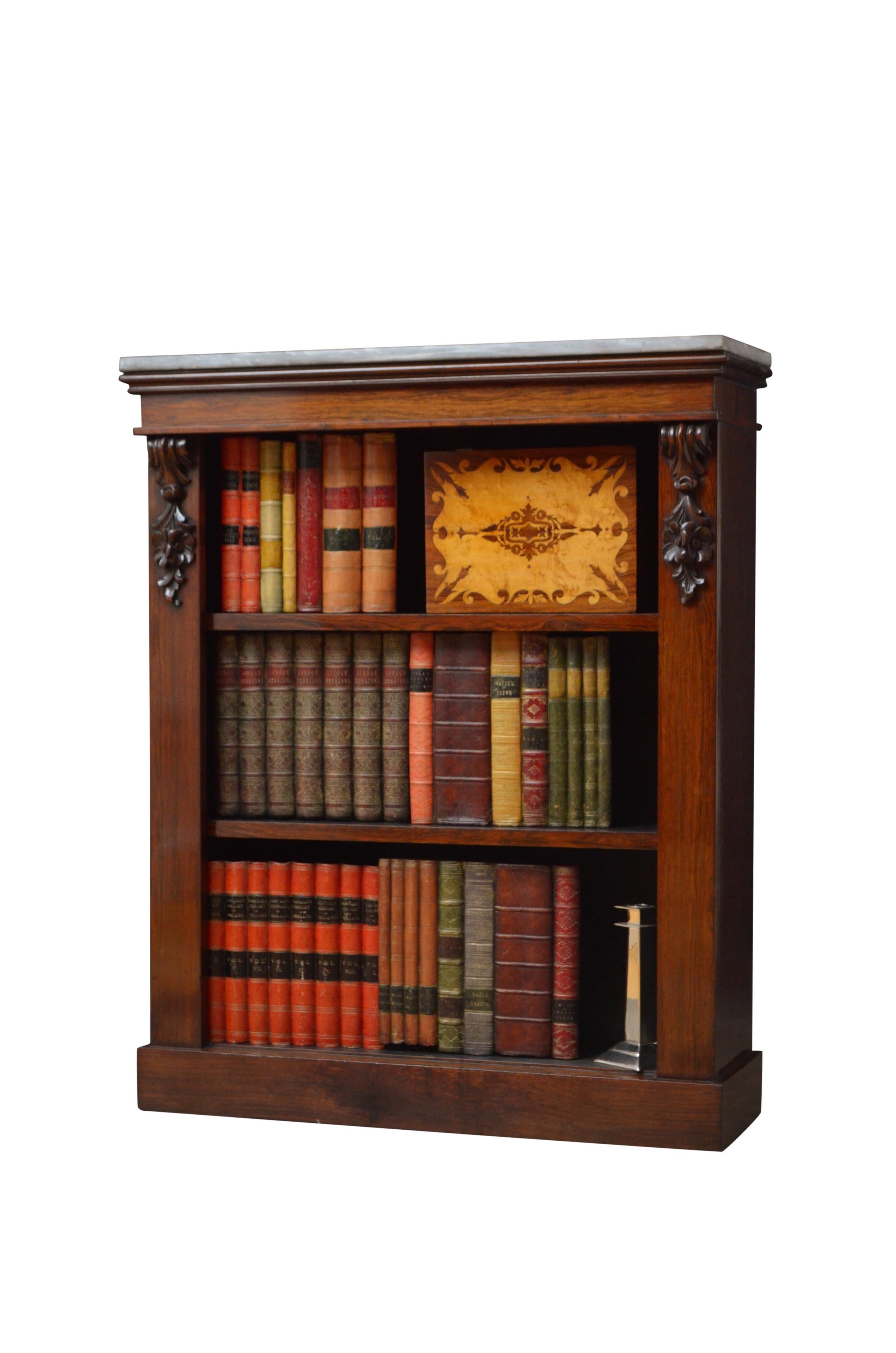 K0506 fine quality early Victorian open bookcase in rosewood, having grey marble top above two height adjustable shelves flanked by floral drop carvings, all standing on plinth base. This antique bookcase retains its original finish which has been