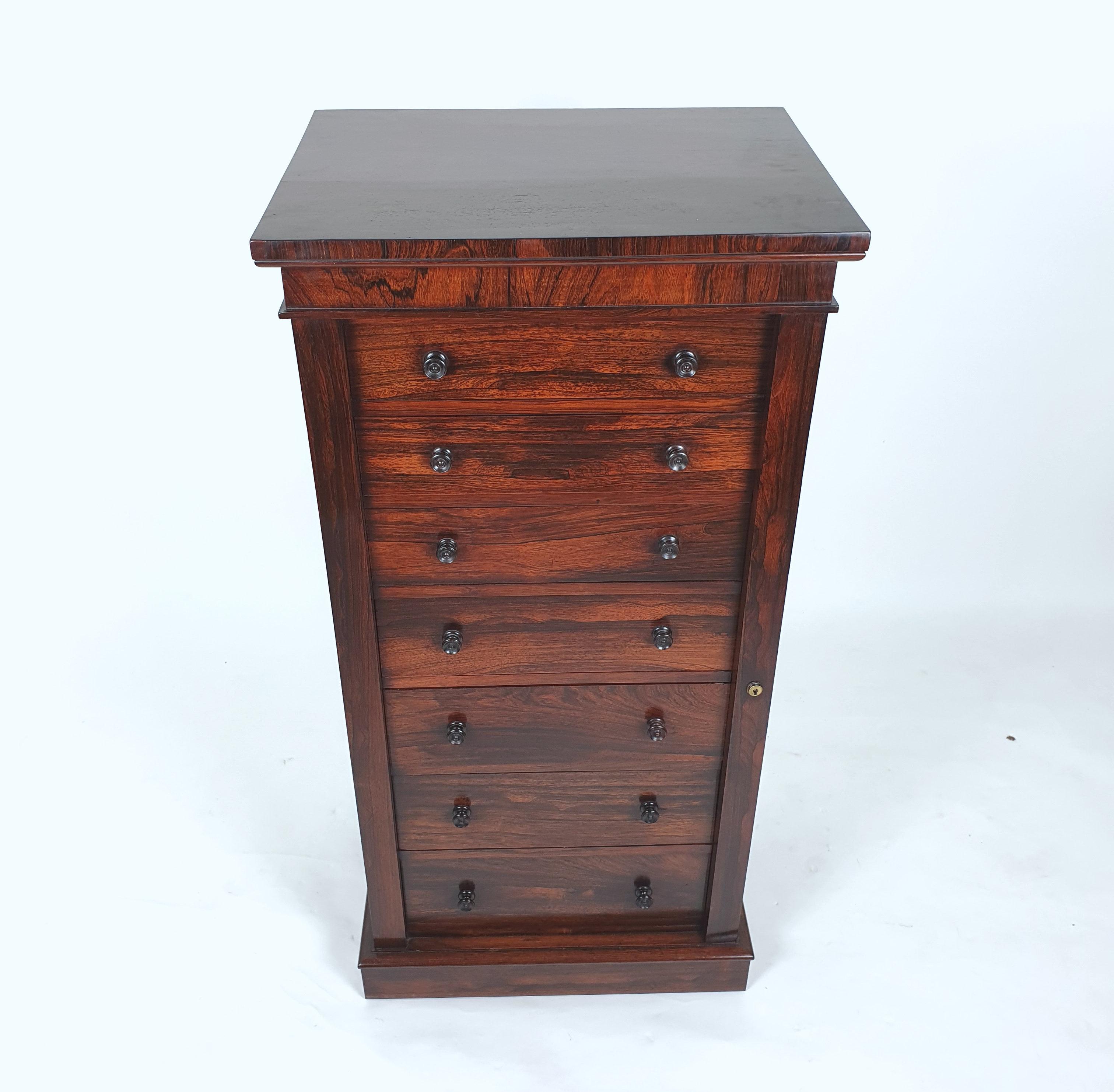 This outstanding and beautifully patinaed chest features 7 slightly graduated drawers on a plinth base with a working lock and key. The chest features 7 slightly graduating drawers and stands on a plinth base. It measures 24 in – 61 cm wide, 17 ¾ in