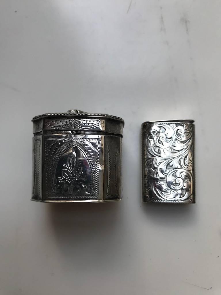 An early Victorian silver vesta case, Birmingham, engraved with foliate scrolls, and a Dutch silver match box. Measures: Case: 1.5