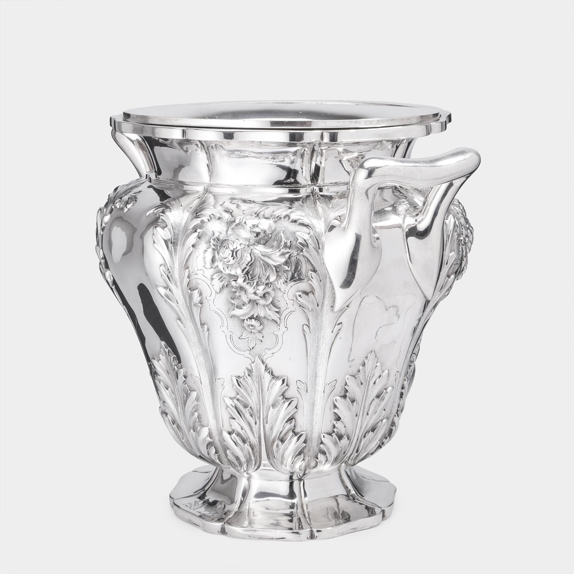 Stunning antique silver wine cooler made by William Bateman II of the renowned Bateman silversmithing family. This melon-shaped cooler with lobed body features Fine hand-chased floral and acanthus leaf decoration and the foot is engraved with two