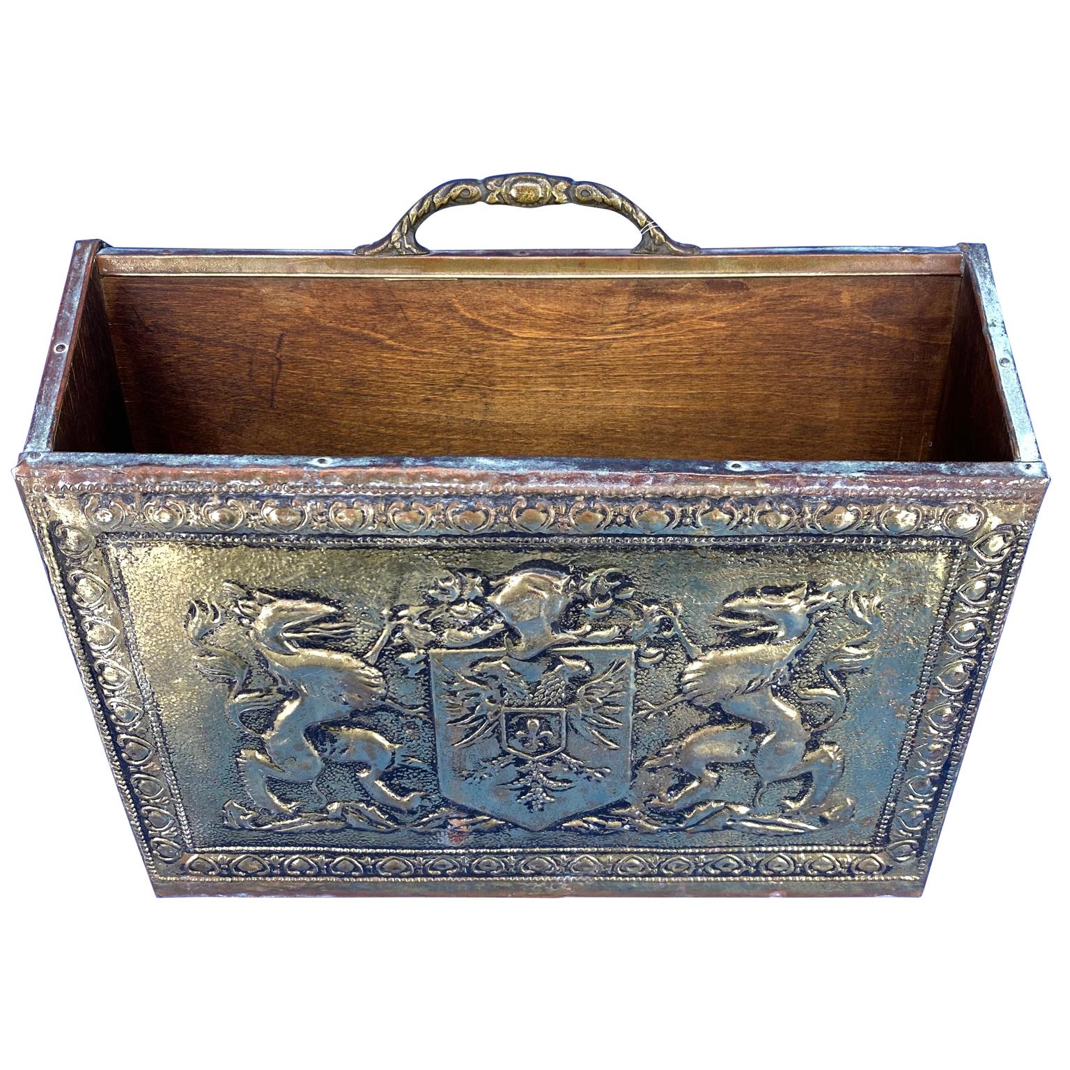 Early Victorian style brass magazine rack with code of arms, griffins and eagles.