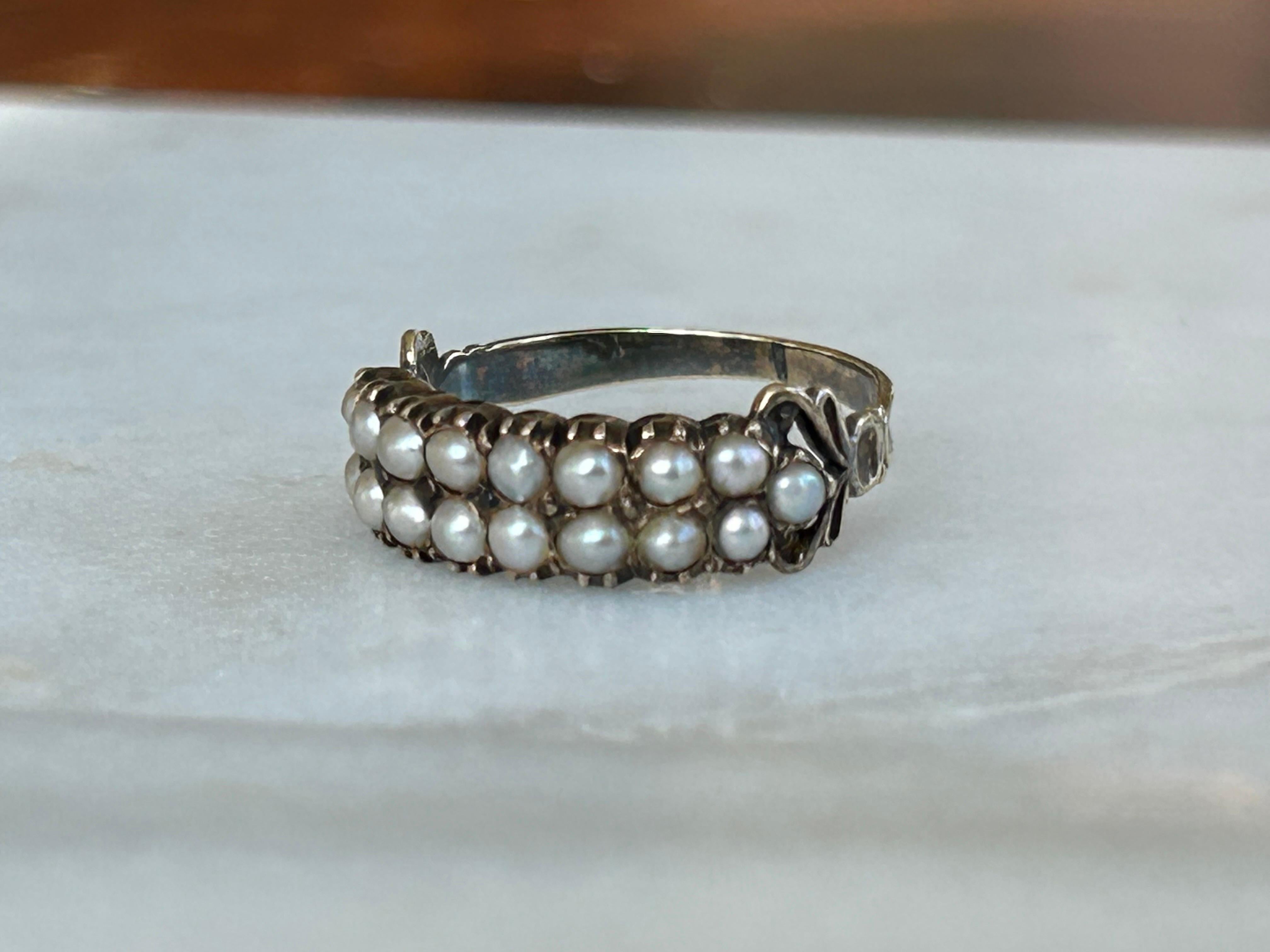 A magnificent Late Georgian/Early Victorian Double-Row Pearl Ring. Exquisitely crafted in 14k gold, this ring is a stunning showcase of the era's love for intricate designs and luxurious materials. The ring features two rows of delicately split