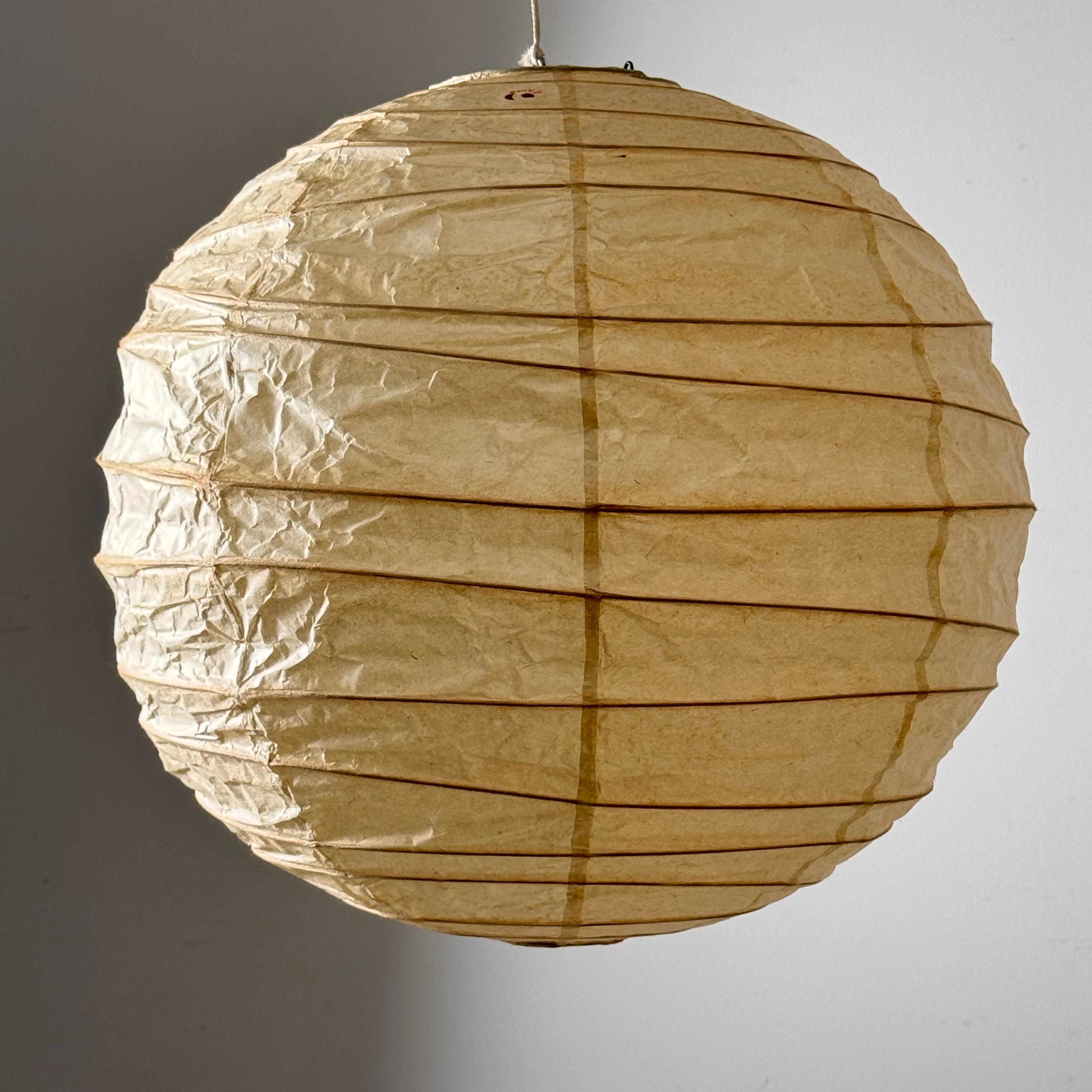 Early and rare unused model 45D Akari light sculpture by Isamu Noguchi 
Manufactured in Gifu Japan by Ozeki circa 1950s

Handmade shade of washi paper over bamboo ribbing with sun and moon stamp marked Japan

Never used, complete with original box