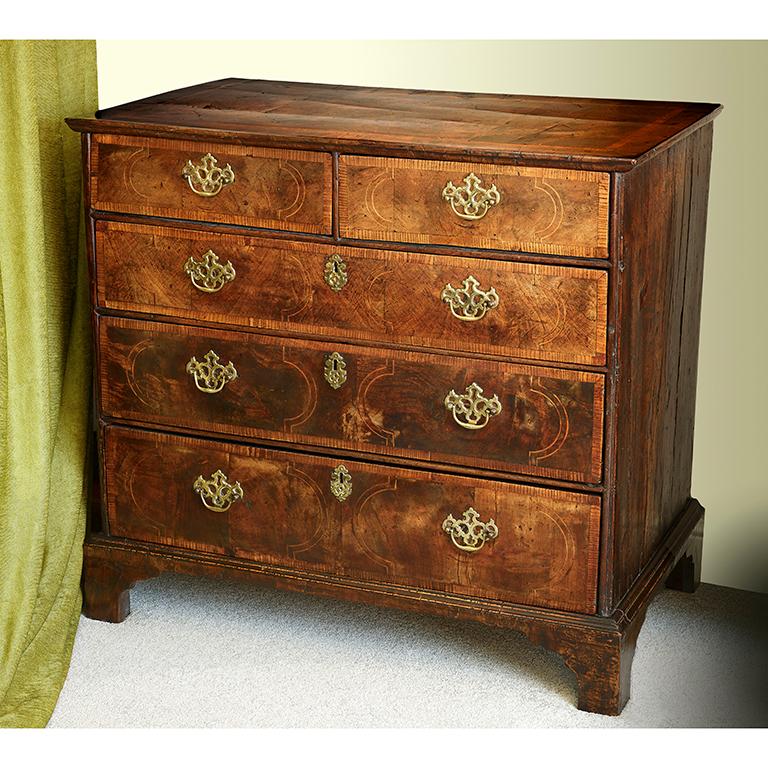 An antique walnut chest dating circa 1720

Measures: Width 36 1/2 inches
Height 34 inches
Depth 22 inches.