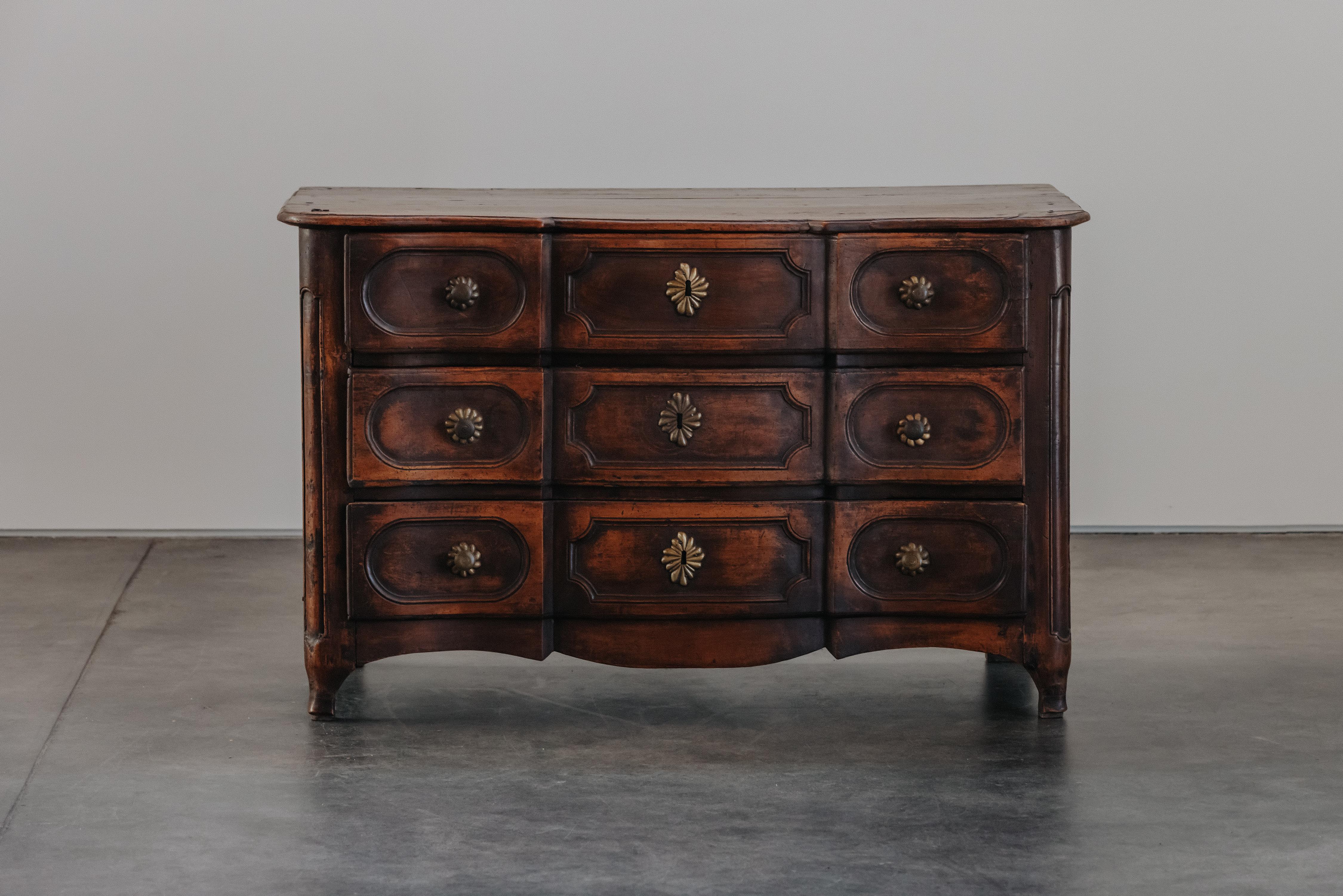 Early Walnut Chest of Drawers From France, Circa 1800.  Solid walnut and pine construction with original hardware.  Excellent patina and use.