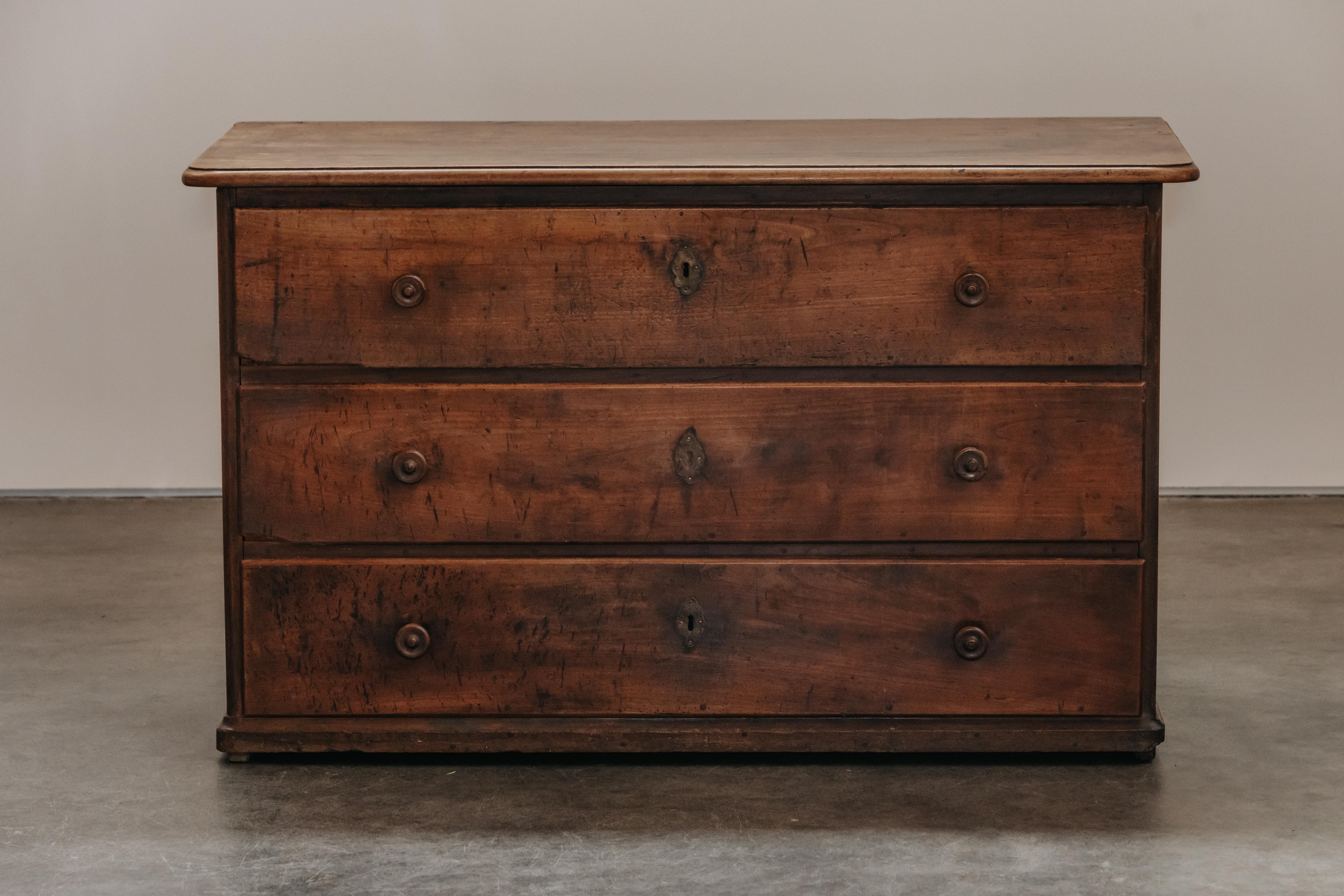 Early Walnut Chest Of Drawers From Italy, Circa 1820.  Solid walnut construction with excellent patina and wear.