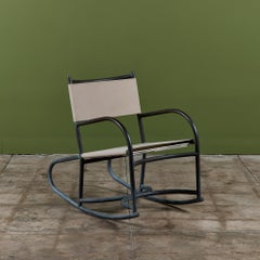 Sedia a dondolo di Walter Lamb in bronzo e tela