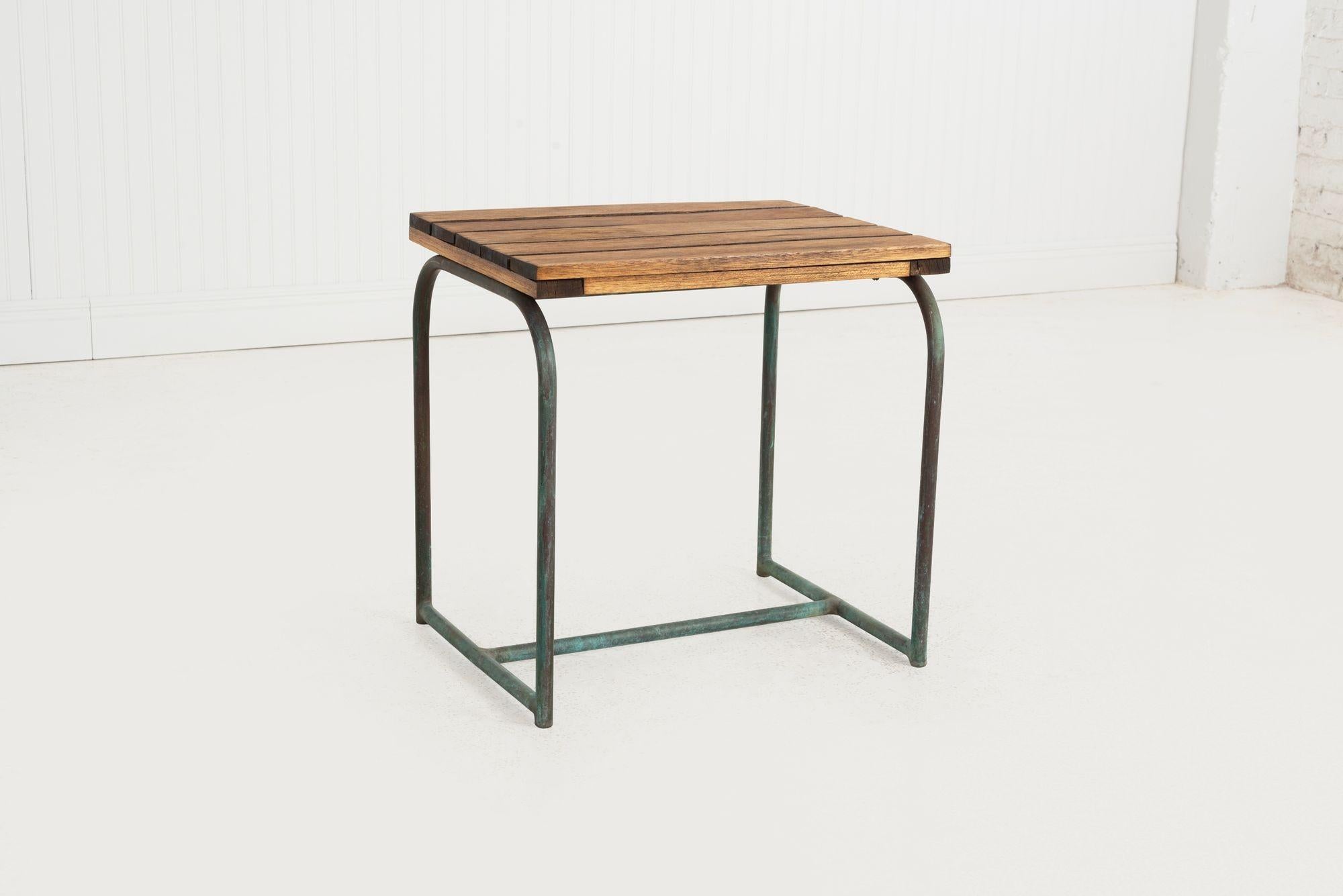 Early Walter Lamb Bronze Occasional Table, circa 1945
A rare early example of Walter Lamb's work, this occasional table features his signature tubular bronze frame with a warm, natural verdigris patina. The top is crafted from solid Tigerwood slats,