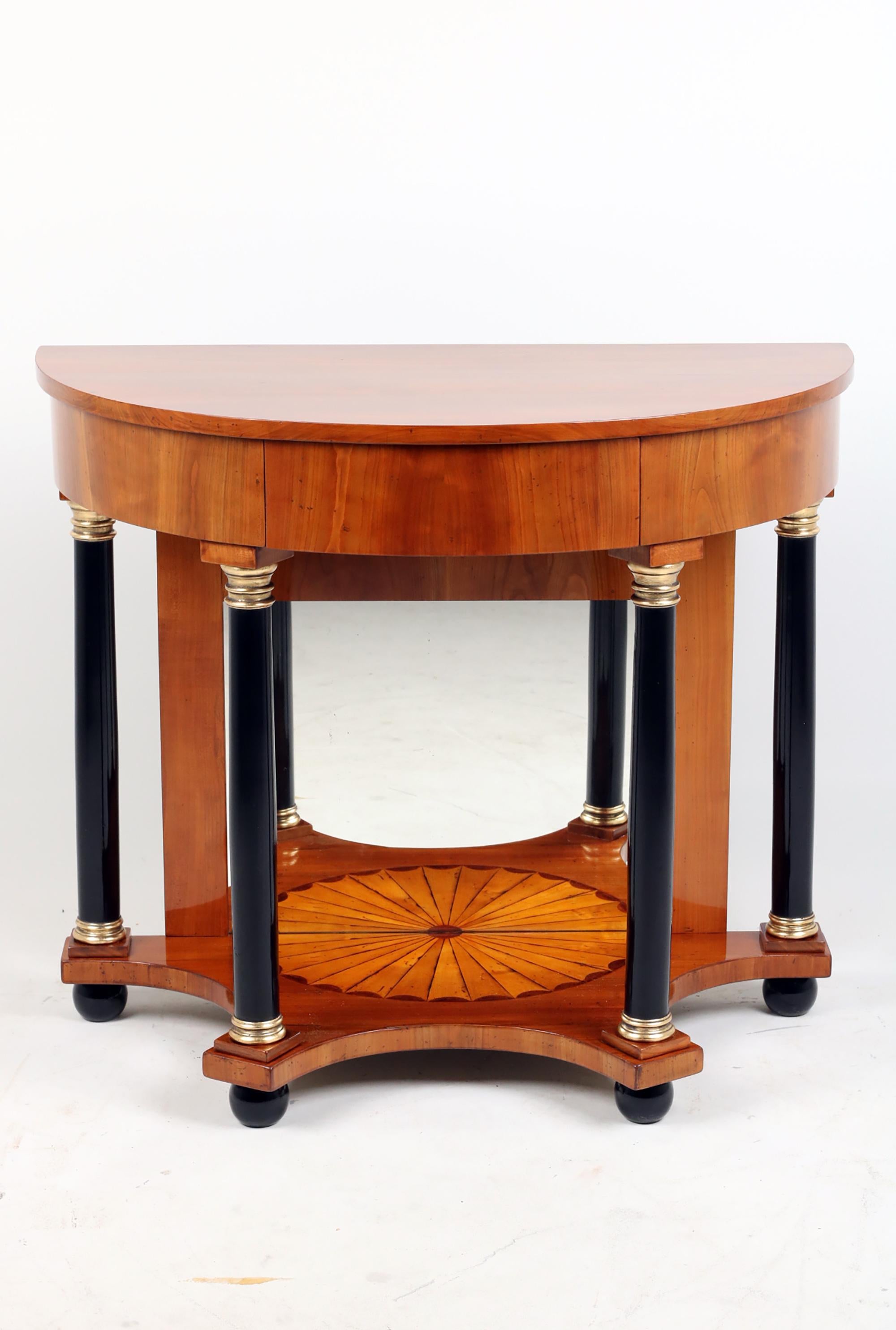 Console, Cherry wood,  1820 Vienna
Standing on four ebonized spherical legs rare Biedermeier console with cherry wood veneered. 
The bottom plate decorated with half circle shape marquetry with fire shading. Mirror on the back. The frame is hold by