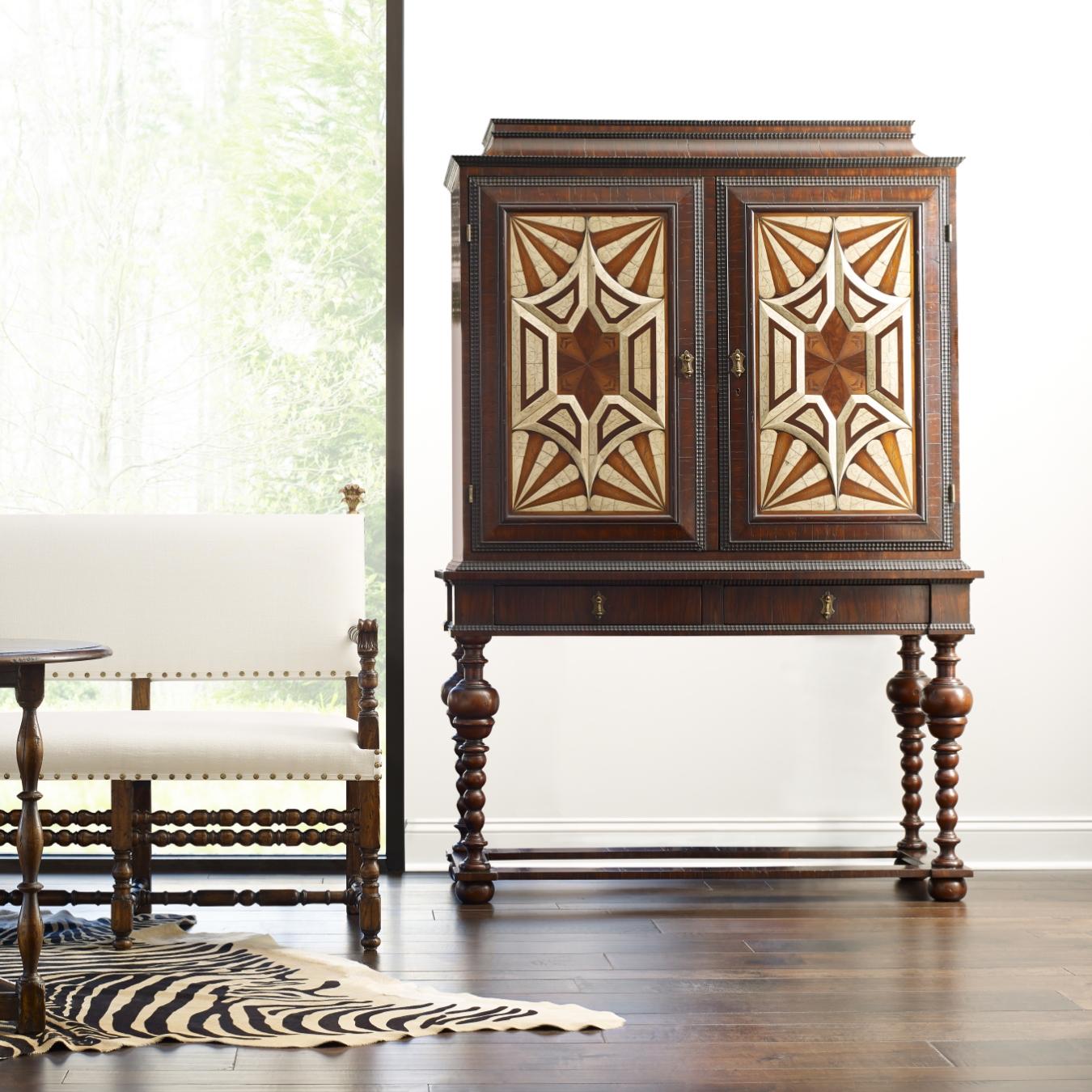 The Toledo armoire is made from wood and has a geometric bone inlay decoration on its doors. Pulling from dutch and Spanish influences, this bold piece is sure to inspire awe.
