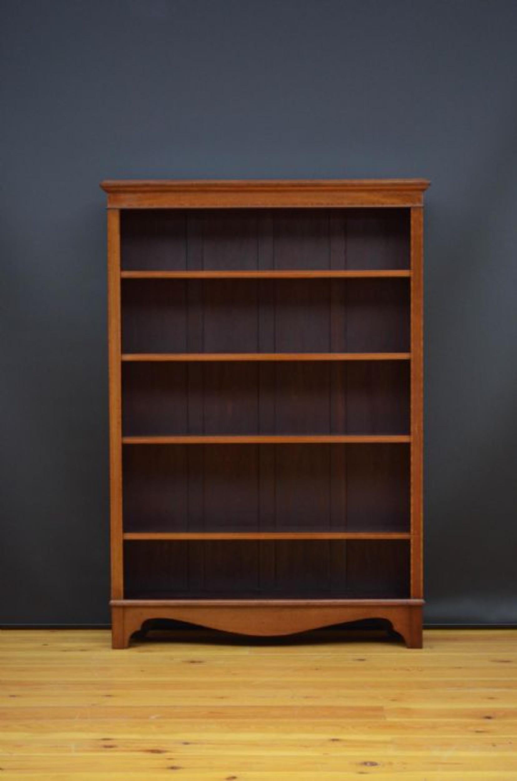 Sn5121 Tall early 20th century open bookcase in mahogany, having figured mahogany top with satinwood crossbanded edge above crossbanded frieze and five height adjustable shelves flanked by satinwood banded pilasters, all standing on shaped bracket