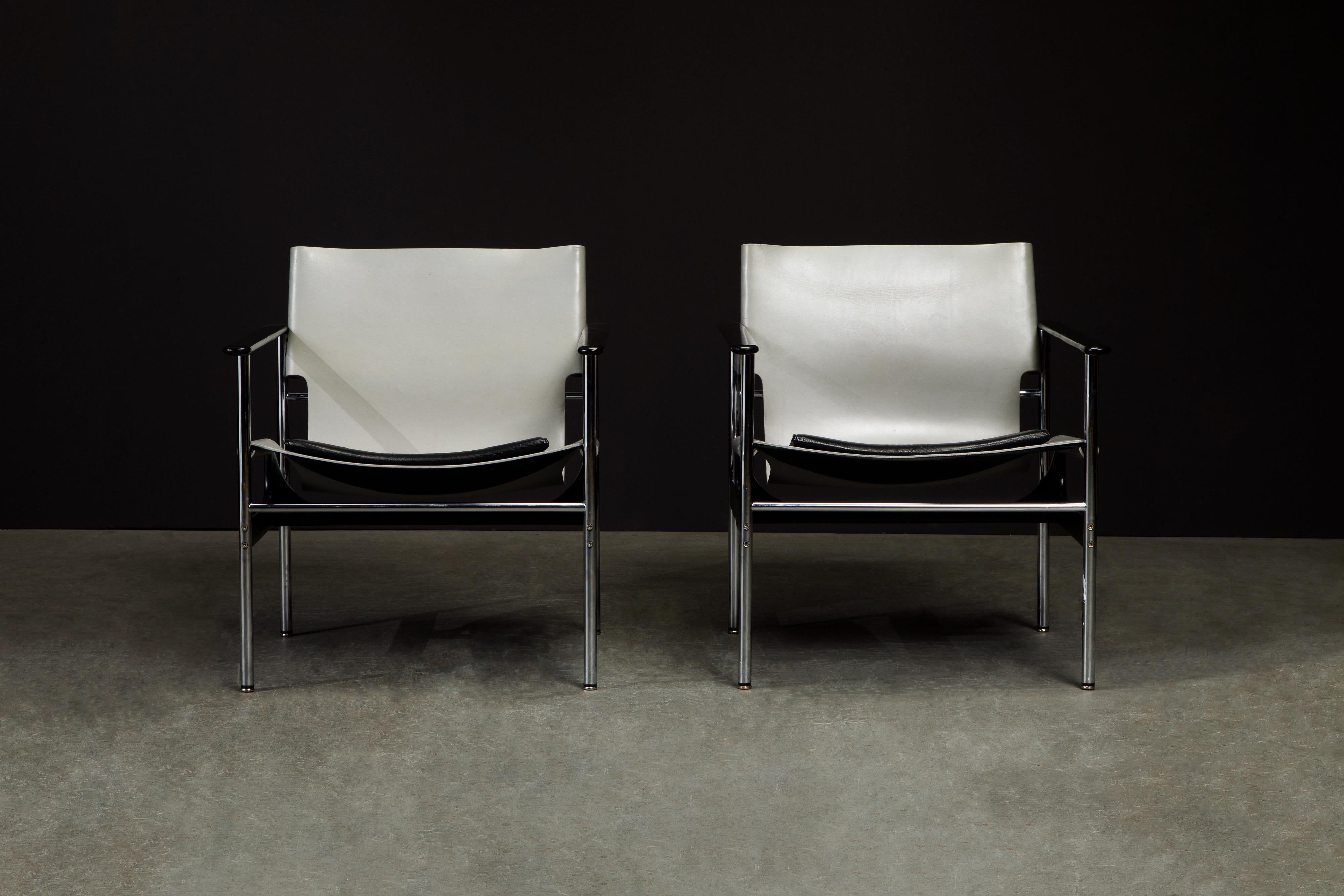 A fantastic pair of early year production examples of the '657' armchair by Charles Pollock for Knoll International, signed with a Knoll International label under the seat cushion as seen in the photos. Rare color combination of gray and black